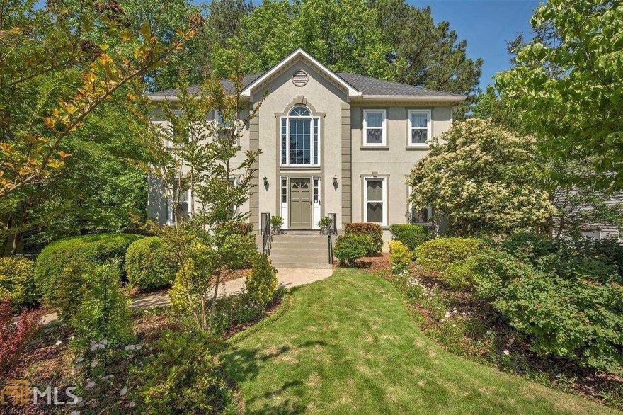 Adorable East Cobb beauty in small quiet subdivision in a park like private setting with amazing landscapes filled with annuals and other beautiful flowers and trees. A true gem with beautiful curb appeal.  Two story grand entrance with tiled floors and neutral paint throughout. Large living room off the front could make a great office with tons of sunlight. Spacious family room with loads of windows bringing in ambient light centered by a fireplace and wainscot accented walls.    Open spacious kitchen with loads of real wood cabinets, stainless and black appliances, center island breakfast bar and access to the screen porch with new skylights and overlooks lush private backyard with beautiful landscaping.  Laundry on main level. Updated half bath with new vanity, toilet and lighting. Upstairs has primary bedroom with sitting room area, tray ceiling and new ceiling fan. Large primary bathroom with expanded dual vanity with large mirror, soaking tub and shower with new glass door.  Updated hall bathroom has new vanity, faucet, lighting and new shower door on tub.   Finished basement is perfect for rec room, play room or office with new flooring.  Spacious garage has ample storage and access to the level driveway.  No HOA!