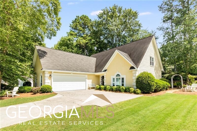 Just a leisurely 7-minute stroll to downtown Alpharetta and all it has to offer, this cutie is ready, willing, and able! Large primary suite on main level w/updated bathroom; two bedrooms and a full bathroom upstairs. Meticulous sellers have made many recent improvements: new carpet, new paint, new light fixtures, new door hinges, gleaming hardwood floors, triple-pane replacement windows, plantation shutters, hardi-plank siding & hard-coat stucco front, lovely eat-in kitchen w/granite counters, white cabinets, new pulls, and stainless steel appliances (fridge only 6 months old, others only 2 years old). Clean as a whistle! Courtyard 2-car garage, low maintenance yard w/established plantings. Very private back patio perfect for your morning coffee & evening beverages! And did I mention that it's just a leisurely 7-minute stroll to downtown Alpharetta? Also very close to Avalon. Why buy an attached townhouse for $900k+ and pay several hundred $ per month HOA dues, when you can pocket several hundred thousand $$, buy this move-in ready single family home w/only a $200 per year HOA fee, and enjoy your privacy...all within walking distance to downtown Alpharetta?