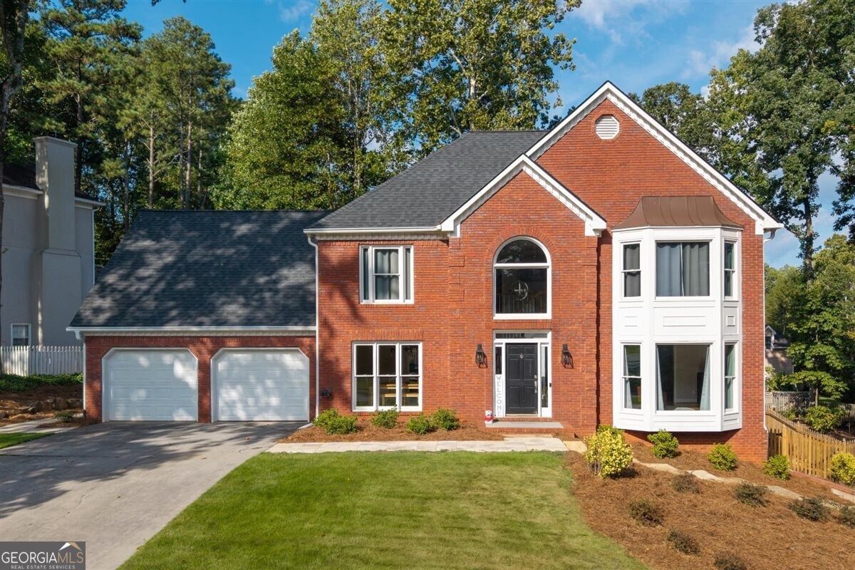 Welcome to this beautifully updated and meticulously maintained home, ideally located in the highly sought-after Brookstone neighborhood-just a short golf cart ride to the Brookstone Country Club. Perfectly blending charm, space, and functionality, this home offers everything today's buyer is looking for. As you enter, you're welcomed by a grand two-story foyer that sets the tone for the rest of the home. To the left, a formal dining room offers the perfect setting for gatherings and holidays. The heart of the home is the updated kitchen, featuring elegant grey cabinetry, quartzite countertops, stainless steel appliances, a breakfast bar, a bright eat-in area, and a pantry. From the kitchen, flow easily into the cozy family room and an additional den or office space-ideal for working from home or creating a quiet retreat. A bright and inviting family/sunroom with walls of windows offers stunning views of the backyard and floods the home with natural light, creating a perfect spot for relaxing or entertaining. Upstairs, you'll find an oversized primary suite with a fully renovated en-suite bath. The spa-like bathroom features double vanities, an oversized shower with a luxurious shower head and panel system-perfect for unwinding at the end of the day. Three additional guest bedrooms, a beautifully updated full bath, laundry, and a spacious bonus room complete the upper level, all accessible via two staircases for added convenience. The finished basement adds even more living space, including a private bedroom and full bath-ideal for guests or multi-generational living-as well as a large family room and a game or pool room for entertaining. This home also boasts several important upgrades, including a roof that is approximately five years old, leaf guards installed on all gutters for low-maintenance living, a two-year-old upstairs HVAC system, and brand-new windows along the back of the home that enhance both energy efficiency and aesthetic appeal.