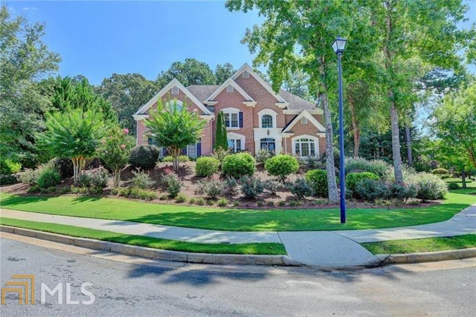 STUNNING brick beauty in desirable gated Crooked Creek! Cambridge High School District! Enter through the states foyer to this warm and inviting home!. Gleaming hardwoods and separate office on main level and separate Dining Room that seats 12+.Completely remodeled Chef's kitchen with gorgeous white cabinetry, gas cooktop ,double ovens and tons of storage! Eat in kitchen area with cozy keeping room with fireplace! Sophisticated den that opens to large screened porch with gorgeous views of private backyard! Bedroom and full bath on main level. Oversized master retreat with renovated spa-like master bath complete with state of the art therapy tub, steam shower and built in sound system! Custom walk in closet with center island. Spacious secondary bedrooms with ensuite baths. Bright daylight filled terrace level that is perfect for entertaining! A circular driveway completes this beautiful home! Hurry in!