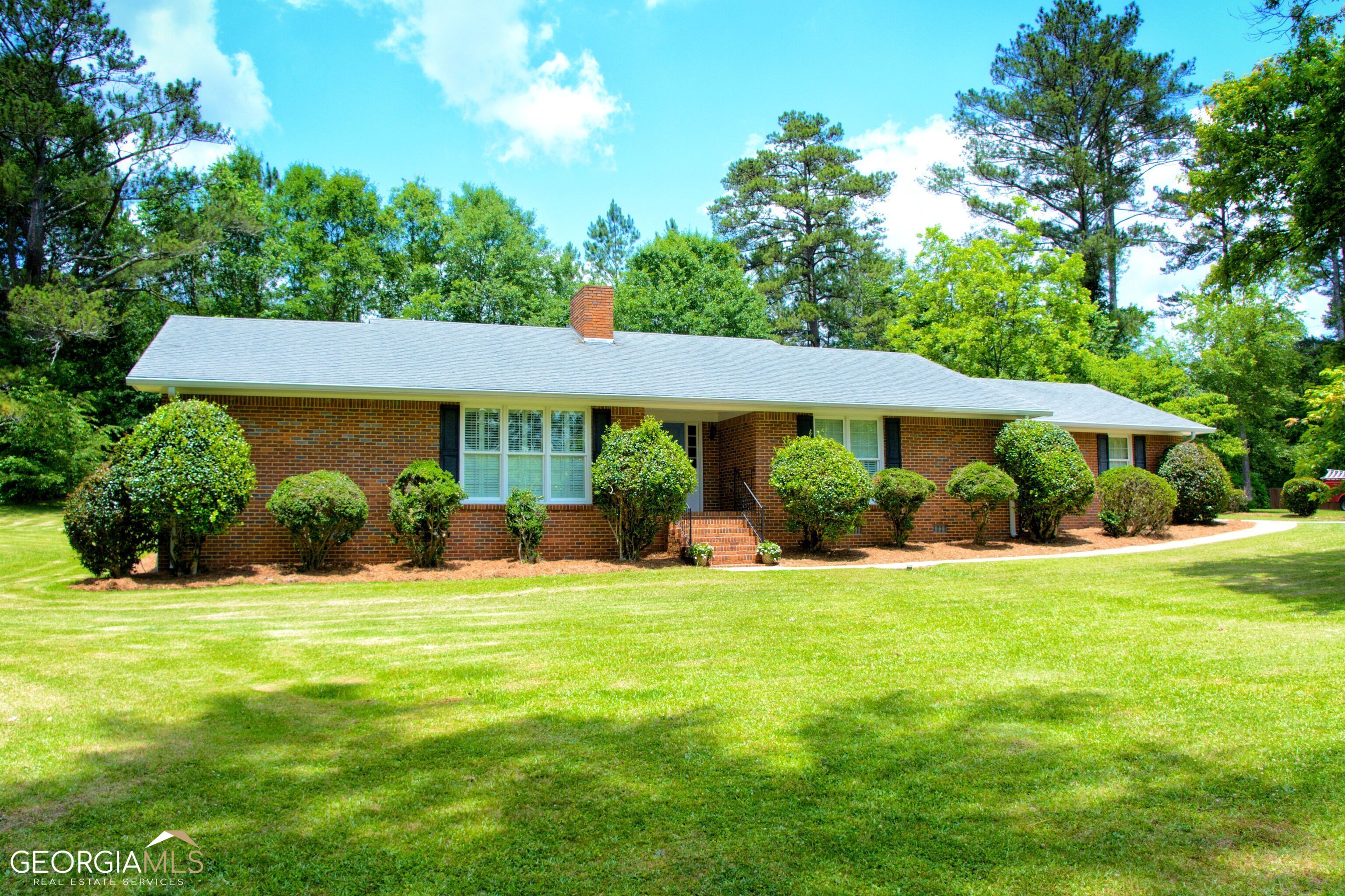 Prime location in Carrollton city. Brick Ranch, 3 BR, 2 BTH. It is 2,000 square feet, has a fireplace, hardwoods throughout, it is move in ready. Lake view with garage and a nice workshop (20x35). This house sits on access to greenbelt 4 minutes from the city square.