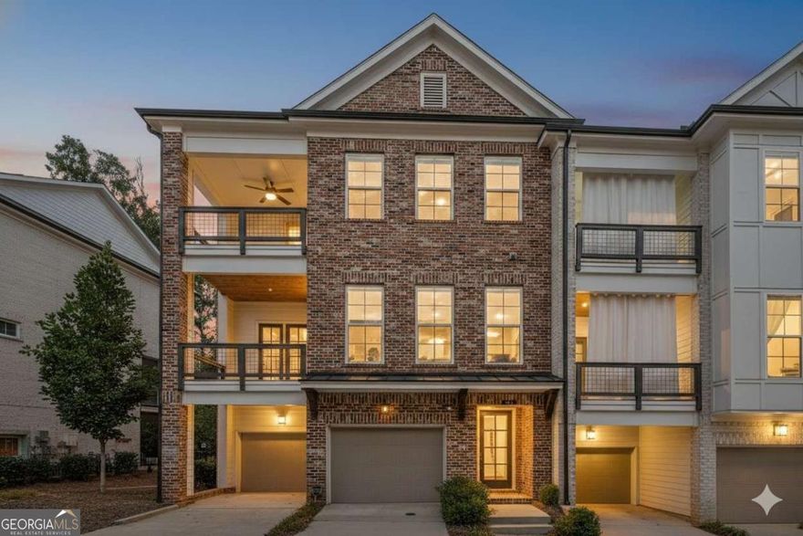 A Like New 2515 Square townhome in Alpharetta. Experience a new level of luxury and convenience in this meticulously designed end-unit brownstone. From the moment you step inside, you'll be greeted by an open-concept layout spanning three spacious stories. The heart of the home is the chef's kitchen, featuring stunning Cambria countertops, upgraded tile back-splash and a large central island. This area flows seamlessly into the family room making the space perfect for both daily living and entertaining. The living area boasts wooden beams accenting the ceiling and a shiplap fireplace with wooden mantle. Retreat to the expansive owner's suite, a private sanctuary complete with a luxurious en-suite bathroom, a free-standing tub, and its own private deck. The shower is a dream with a regular shower head, handheld sprayer and rainwater faucet overhead. The luxurious soaking tub includes a hand held sprayer as well. The primary bedroom's generously sized walk-in closet is a dream come true, offering custom shelving and drawers to keep your wardrobe perfectly organized. With four bedrooms and three-and-a-half bathrooms, there's lots of space for family and guests. Full terrace level with large bedroom, full bath and extra storage. Complete with terrace level private back patio. Complete with a 2 car garage with overhead storage. This home offers plenty of options for outdoor relaxation with not one, but three covered decks, a terrace patio and a cozy fenced backyard area. Modern living is made easy with seamless Alexa smart home capabilities integrated throughout as well a complete security system. Take advantage of fantastic community amenities, spend your days relaxing at the pool and cabana, playing bocce ball, or gathering around the fire pit with neighbors. Located in a lively mixed-use development, you'll be steps away from the Maxwell's retail which includes Fairway Social for entertainment, and one of the best Thai, Sushi and Seafood Restaurants in the area...all steps away. For both keeping active and connectivity there is the Alpha Loop, leading to downtown Alpharetta and the Avalon, with an array of dining, entertainment and shopping options at your fingertips.  This is more than a home-it's a lifestyle. Living at The Maxwell means you can leave the car at home and truly enjoy everything Alpharetta has to offer. If there's a "best places to live," "best places to raise a family," or "best community" list somewhere, there's every likelihood Alpharetta is on that list. Alpharetta is one of the most desirable places to live in Georgia and the nation. Come view this amazing townhome, it's what you've been looking for!