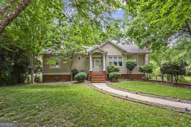 MOTIVATED SELLER!!! PRICE REDUCED TO SELL!!!! SELLER OFFERS $5,000 IN CLOSING COSTS!!! Opportunity in East Cobb!!! Great school district, main level features 2 bedrooms and 2 baths. There is an in-law apartment in the basement with 2 bedrooms, 1 full bathroom and kitchen. Many upgraded features, roof, air conditioner and water heater are less than 2 years old. There are hardwood floors and ceramic throught out the main level. The kitchen has stainless steel appliances, ceramic tile countertops and backsplash, custom stained cabinetry, over/under cabinet lighting, recessed lighting and access to the deck. The family roon has fireplace, custom built-in TV cabinet and access to the deck. The master bedroom has custom walk-in closet, jetted tub and separate shower. The deck has a hook up for a grill, the backyard is fenced and has double gates for a trailer or boat. You must see it!!!