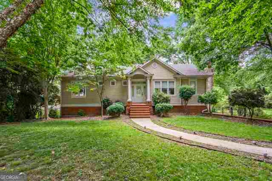 MOTIVATED SELLER!!! PRICE REDUCED TO SELL!!!! SELLER OFFERS $5,000 IN CLOSING COSTS!!! Opportunity in East Cobb!!! Great school district, main level features 2 bedrooms and 2 baths. There is an in-law apartment in the basement with 2 bedrooms, 1 full bathroom and kitchen. Many upgraded features, roof, air conditioner and water heater are less than 2 years old. There are hardwood floors and ceramic throught out the main level. The kitchen has stainless steel appliances, ceramic tile countertops and backsplash, custom stained cabinetry, over/under cabinet lighting, recessed lighting and access to the deck. The family roon has fireplace, custom built-in TV cabinet and access to the deck. The master bedroom has custom walk-in closet, jetted tub and separate shower. The deck has a hook up for a grill, the backyard is fenced and has double gates for a trailer or boat. You must see it!!!