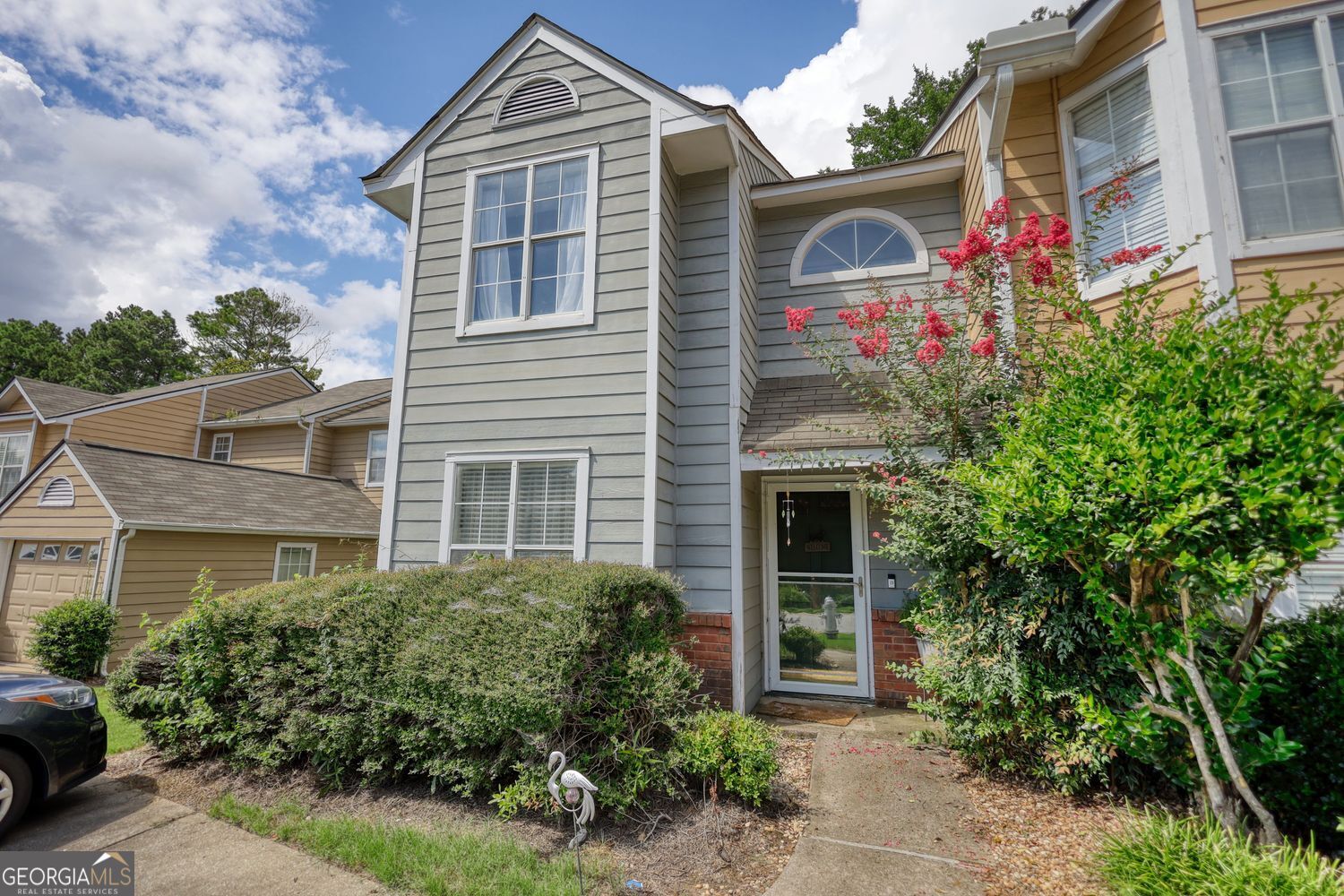 Welcome to this well-maintained 2-bedroom, 2.5-bathroom end-unit townhome in a prime location offering comfort and tranquility. Conveniently in front of the swimming pool, this property boasts a fenced backyard perfect for pets, gardening, or private gatherings. Inside, you'll find hardwood floors that add warmth throughout, along with a separate formal dining room. Located close to I-85 in a walkable area with sidewalks. You'll also enjoy the nearby park with its playground and peaceful fishing lake just a short stroll away, plus endless options for dining and nightlife. With its unbeatable location and inviting features, this townhome is ready to welcome you home.