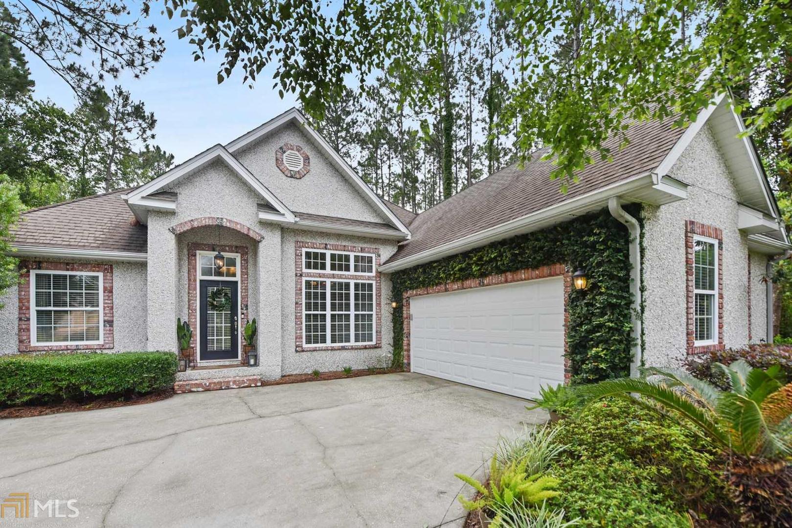 Enjoy this private 3-bedroom, 2-bathroom home located in the exquisite Osprey Cove gated community. This beautiful home features granite countertops in the kitchen with large windows overlooking the lush backyard. Wood flooring throughout main living areas and carpet in bedrooms. The spacious living room showcases a tiled fireplace to relax and enjoy! Enter the master suite with trey ceilings and the master bathroom with double vanities, large jetted tub, and separate shower. Flex space over the garage, perfect for a private bonus area or home office. Experience the secluded backyard from the screened porch to enjoy the lush landscaping. Osprey Cove club membership available with transfer fee.