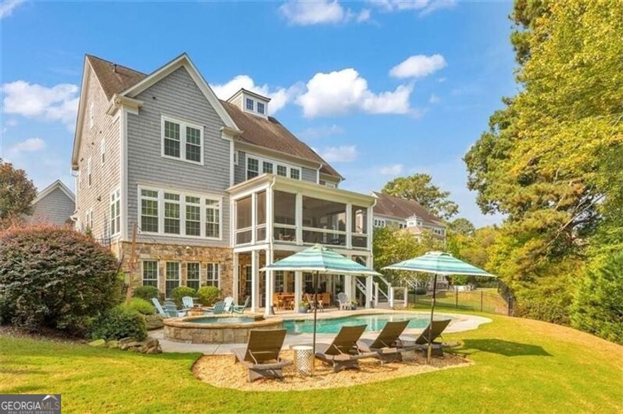 Enjoy the best that East Cobb has to offer! Experience the pinnacle of suburban living in this breathtaking 6 bed / 6.5 bath home nestled in an exclusive 5-home community within the sought-after Pope High School district. This residence offers a true outdoor oasis with a heated saltwater gunite pool, spa, and breathtaking lake views. Entertain around the fire pit, relax on the lower patio, or enjoy the screened-in upper porch with a gas line - ideal for year-round living. Step inside to an immaculate home that showcases thoughtful attention to detail at every turn. The Family room features coffered ceilings, custom built-ins with shiplap accents, and a gas log fireplace. The gourmet kitchen opens to the Family Room and is equipped with brand New high-end Jenn-Air appliances, including a 6-burner gas range with a griddle and double ovens, Built-in Sub Zero Refrigerator, a drawer microwave and dishwasher. The center island seats 6 and features quartz countertops and a breakfast area overlooking serene lake views. Additional features include a pantry with wood shelving, a tiled Mudroom with storage cubbies plus two built in "homework" desks and a butler's pantry with quartz countertops. Retreat to the primary suite that boasts tray ceilings and a spa-like bathroom with his and hers vanities, a soaking tub, a seamless glass shower, and huge walk-in closet with custom shelving system. All Bedrooms offer private baths and New seamless glass shower doors have just been installed. The Terrace level is fully finished with a Large Media room, Guest Suite with Full bath, Storage Room and Home office.  The owner has recently added new engineered hardwood floors thru out plus brand-New custom built-ins in the Media Room and a New built in dry bar area with a Jenn Air wine fridge. The three-car garage features a bonus room, perfect for an office, gym, or extra storage. Other features include transom windows and Nest thermostats. Exterior updates include professional lighting with timers, a professional drainage system, and an irrigation system. The Five Lakeside community fee covers landscaping for both front and backyards and boasts its own private park for homeowners, providing an ideal space for relaxation and recreation. Residents can also enjoy fishing on the stocked lake.
