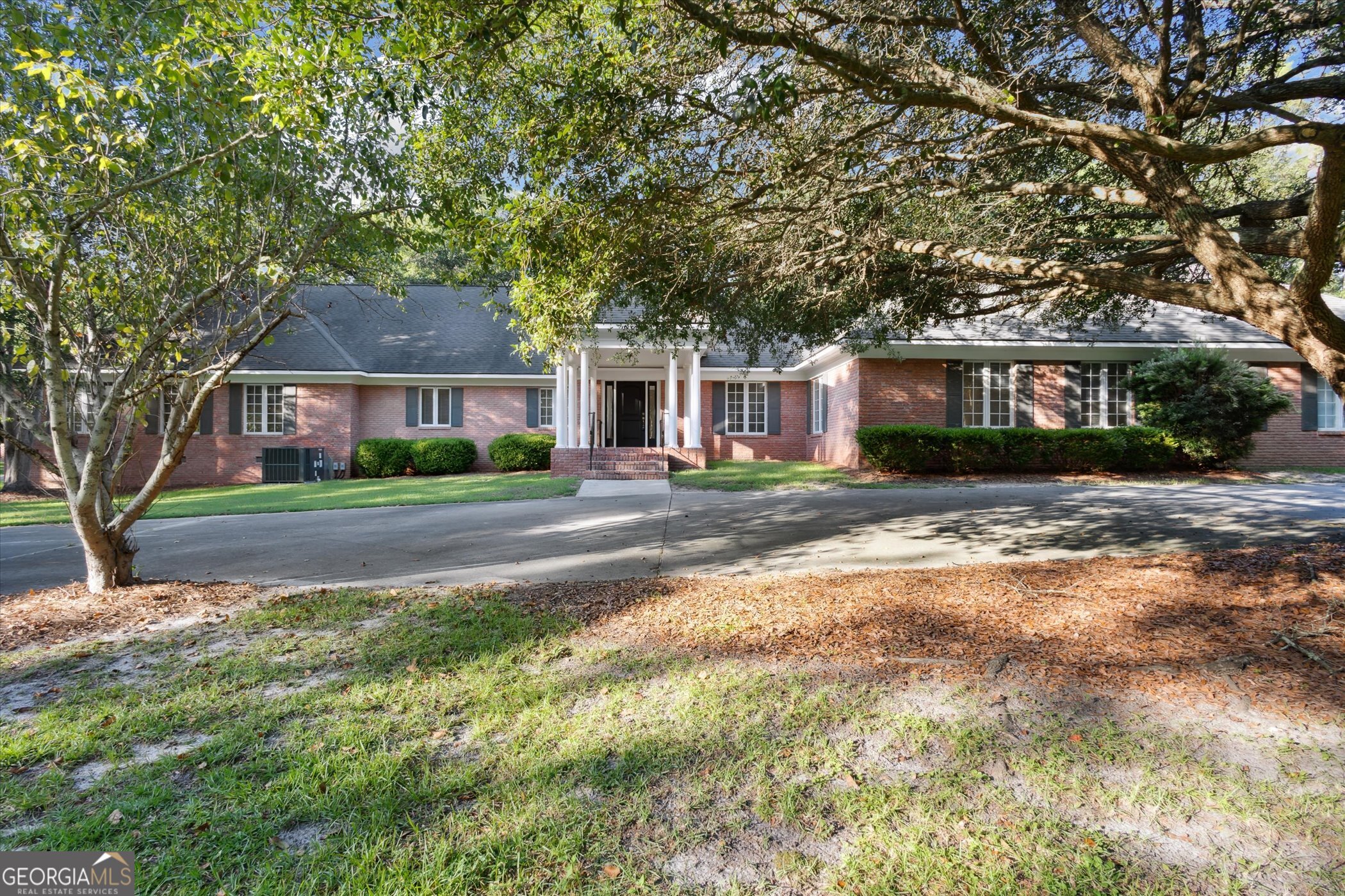 Experience the charm and elegance of this professionally remodeled 6-bedroom, 5.5-bath brick home situated on 3.35 private acres in a well-established neighborhood. Conveniently located near schools and shopping, this property offers the perfect blend of sophistication and functionality. Four of the six bedrooms are luxurious suites, each featuring designer-inspired bathrooms. The living room boasts stunning French doors that open to a large covered porch with a brick floor, overlooking a spacious brick shop/storage building. A formal dining room sits to the right, while the chef's kitchen is a true delight with shaker cabinets, granite countertops, a large island, and a cozy breakfast area. Access the kitchen through a charming swing door for added elegance. Additional features include 9' ceilings, LED Lighting, ceramic tile, a laundry room with ample cabinet space, a 22x22 bonus room with a half bath that opens to the garage, and fireplaces throughout the home. The mahogany cabinets and shelves in the home office/study exude warmth and sophistication. The grand circular driveway leads to an impressive front entry, perfect for welcoming guests. There's plenty of space to expand or simply enjoy the serene surroundings. Don't miss this one-of-a-kind property! Click the link below for a Virtual Tour https://www.asteroommls.com/pviewer?hideleadgen=1&token=N0LdCGthe0mLO5yvlivCZA