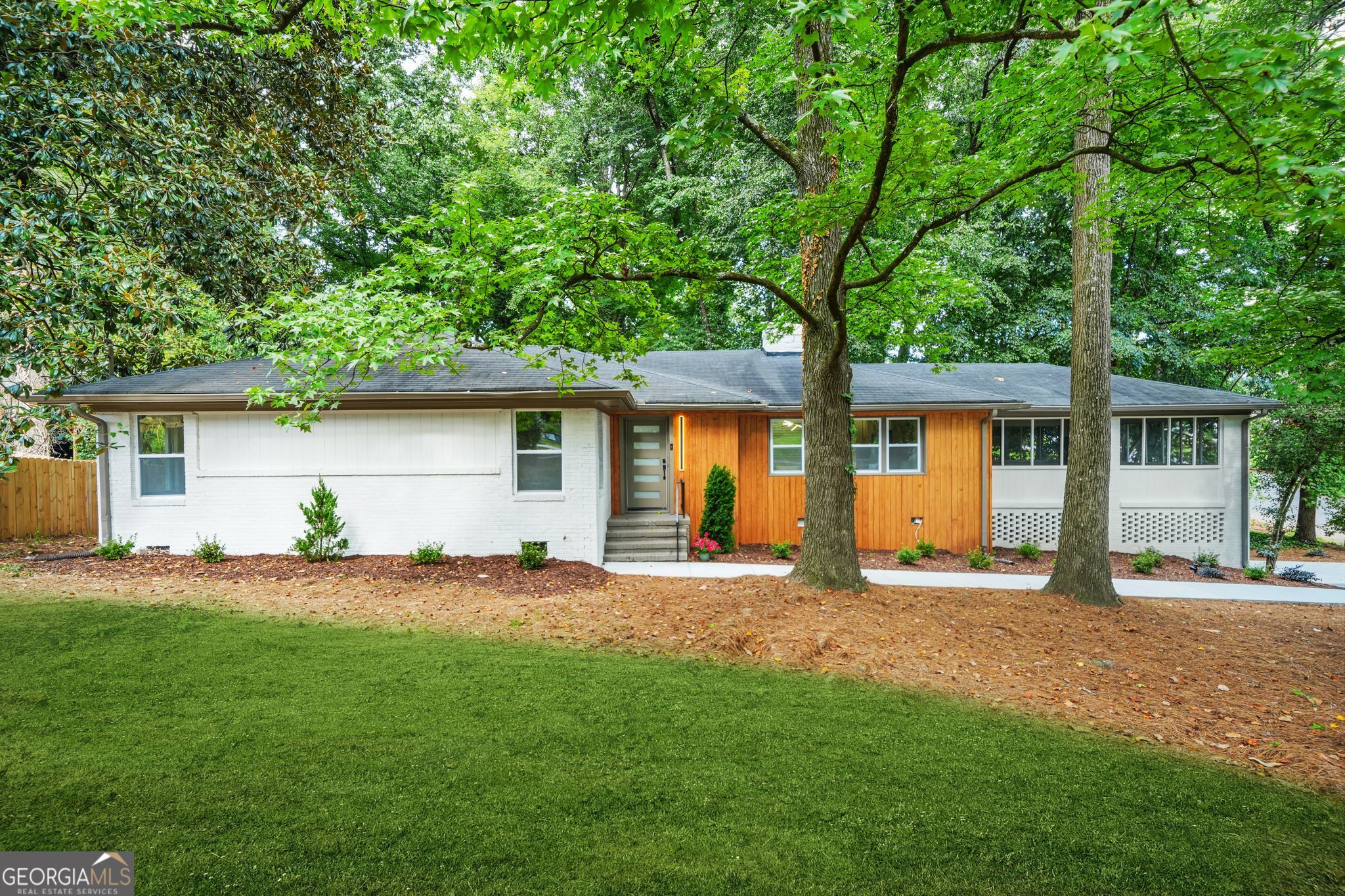 Beautifully Renovated 3-Bedroom, 2-Bathroom Home on Half an Acre Oasis in Sandy Springs, GA Welcome to 5975 Brookgreen Rd, a stunning 3-bedroom, 2-bathroom home in the heart of Sandy Springs, GA. Meticulously renovated with modern upgrades throughout, this charming home offers 1,717 sq ft of living space, combining contemporary elegance with transitional comfort. Located on a quiet, private half-acre corner lot, it provides the perfect blend of tranquility and convenience. Key Features: * Hardwood Floors: Beautiful, durable hardwoods throughout the living areas and bedrooms adding warmth and sophistication. * Renovated Throughout: New tile flooring, fixtures, and finishes have added fresh, stylish touch to every room. * Spacious Sunroom & Patio: Enjoy abundant natural light in the sunroom, perfect for relaxation or as a home office. The outdoor patio is ideal for entertaining or dining al fresco. * Gourmet Kitchen: Fully upgraded with all new high-end appliances, custom cabinetry, and sleek countertops. Perfect for culinary enthusiasts. * Primary Suite with Custom Closet: The primary bedroom features a custom-designed walk-in closet for ultimate organization and convenience. * Luxurious Spa-Like Bathroom: The primary bath features a modern walk-in shower, offering a serene retreat after a long day. * Brand-New Systems: Newly installed A/C, water heater, and furnace ensure years of worry-free comfort. * Newly Paved Driveway: Freshly paved for enhanced curb appeal and easy access. * New Interior and Exterior Paint: Both the interior and exterior have been freshly painted to enhance the home's visual appeal. Community & Location: This home is ideally situated within close proximity to excellent schools, parks, and a variety of shopping and dining options. Enjoy convenient access to Roswell Road, and take advantage of nearby Sandy Springs amenities, including: * Sandy Springs Perimeter Center: A hub for business, shopping, and dining, just minutes away. * Shops at Abernathy Square: A short drive to retail outlets and trendy dining spots. * Parks & Green Spaces: Explore nearby Abernathy Greenway Park and Morgan Falls Overlook Park, perfect for hiking, biking, and family outings. Nearby Hospitals & Healthcare: * Northside Hospital - Just a short drive away for convenient access to medical services. * Emory Saint Joseph's Hospital - Located nearby, offering comprehensive healthcare. Of note: Northside Hospital and Emory St. Joseph's Hospitals are touted as the best in Atlanta for Heart, Cancer and Maternity Care. Easy Access to Major Highways: * Minutes from I-285 and GA-400, offering a quick commute to downtown Atlanta, Buckhead, and the greater metro area. Whether you're looking for a peaceful retreat with modern amenities or a conveniently located home near everything Sandy Springs has to offer, this beautifully renovated property is the perfect fit. Schedule a tour today to experience the charm and elegance of 5975 Brookgreen Rd in person!