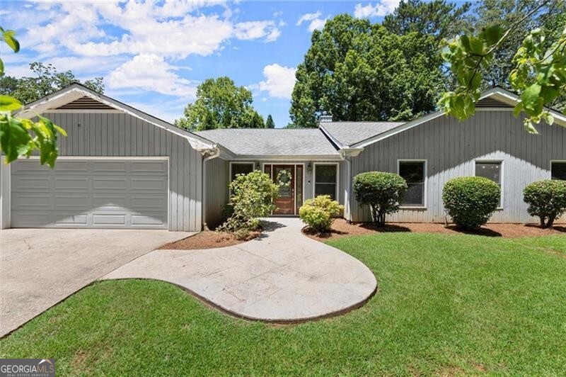 Welcome to this sprawling ranch-style home in East Cobb in an exceptional location on a large lot, just minutes away from top shopping and dining destinations! Nestled in the heart of East Cobb, this home is part of one of the most prestigious school districts in Georgia including the highly sought-after award-winning Walton High School and top-rated Dickerson Middle and Mount Bethel Elementary School. Enjoy an active lifestyle in the desirable Willow Point subdivision - a swim and tennis community, complete with a basketball court, playground, and pavilion. And benefit from easy access to Chattahoochee National Park and nearby hiking trails plus top shopping and dining destinations less than 2 miles away including The Avenues of East Cobb, Publix, Trader Joe's, Whole Foods, Target, and more. Set on a large lot at the entrance of Willow Point, this spacious ranch-style home boasts generously sized bedrooms and an array of living spaces. As you step inside, you're welcomed by a double-sided foyer entry, leading you into the heart of the home. The semi-open floor plan seamlessly connects a warm fireside family room, a formal dining room, and an inviting eat-in kitchen. The kitchen boasts abundant storage, a cozy breakfast table area, and an island with bar seating, making it the perfect space for gatherings and casual meals. The second spacious living area features a wet bar and a sunroom, making it a versatile space perfect for teenagers, playrooms, or entertainment. The oversized primary suite is complemented by 3 secondary bedrooms, each with their own bathroom and custom walk-in closets for ample storage. There's also a dedicated office - perfect for working from home or for kids to use as a study room. The home's exterior features a screened-in porch as well as a patio overlooking a vast, flat backyard-ideal for gardening, outdoor gatherings, or even for adding a swimming pool. Additionally, the property includes a basement with a workshop area, providing endless possibilities for storage. This rare find is ready for its next owners to personalize and transform into their dream home or take advantage of the generous lot to build a stunning new luxury residence potentially facing Timber Ridge Road. As the area transforms with new luxury homes, this property stands out with its potential for rebuild or renovation. The exceptional location not only offers easy access to Timber Ridge but also places you amidst high-value homes and new communities that highlight the increasing market demand. Ideal for those looking to create a custom home in a thriving neighborhood and area, this lot is a rare gem ready for your vision.