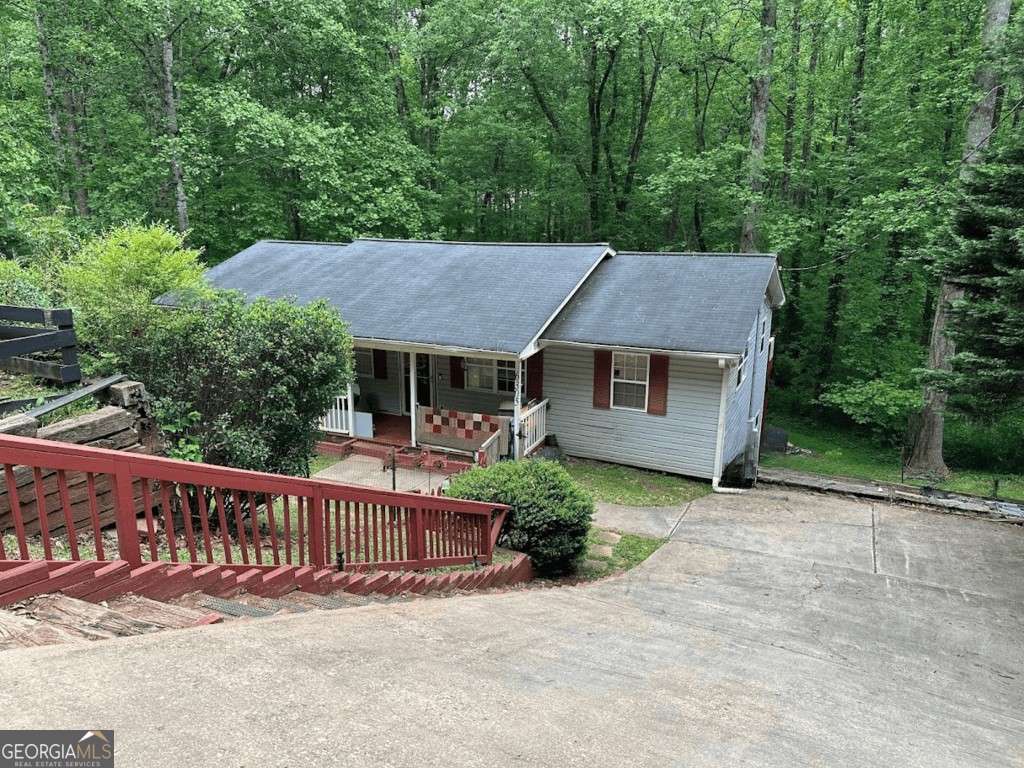 Investor special or the perfect opportunity for a buyer ready to add value! Welcome to 6305 Eidson Drive, Cumming, GA 30041 - a spacious home in the desirable North Forsyth area with flexible living space and income potential. The main level features 3 bedrooms and 2 full baths, along with a generously sized living area and an eat-in kitchen. Downstairs, the fully finished terrace level includes 3 additional bedrooms, a full bath, and a second kitchen-complete with both an interior and private exterior entrance. It's ideal for a separate rental unit, in-law suite, or multi-generational living. The home has served as a rental and will need some TLC, but the layout and location make it a smart investment. Nestled on a quiet street with no HOA, the property offers privacy and room to make it your own. Located just minutes from Lake Lanier, top-rated Forsyth County schools, shopping, dining, and GA 400 access. Sold as-is-bring your vision and unlock the full potential of this unique property!