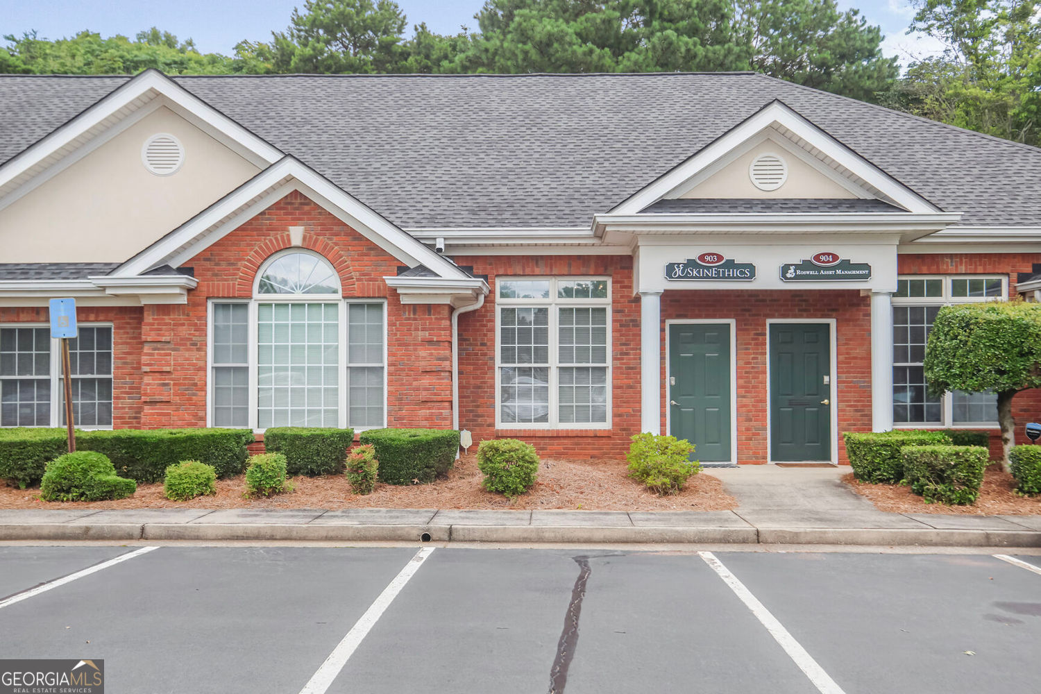 Beautifully Updated Unit in beautifully kept Office Park, which offers access from both Crossville (Hwy 92) and Crabapple Roads. The front Reception adjoins a light-filled Conference Room/Display Area/Admin Office with upgraded barn door. The connecting hallway leads to 3 other spacious offices, a wet bar/kitchenette and private restroom, and a small storage/file/workroom. New Wood Laminate Flooring throughout with fresh Neutral Gray Walls. New Counters and Bathroom Vanity updated in past 2 years. Located close to central mailbox hut. This 25 building office park features nearly 125,000sf of individually owned office condos and offers attractive retail in front of the park, including a wine bar, BBQ restaurant, pharmacy, auto maintenance shop, QuikTrip and much more! Office Park is located close to Historic Roswell offering many lunchtime dining and client entertaining options. Low condo fees of approx. $155/mo include water, sewer, trash, roofs, exterior maintenance, building insurance, and landscaping. Perfect office for you or as an investment opportunity! NO rent restrictions!