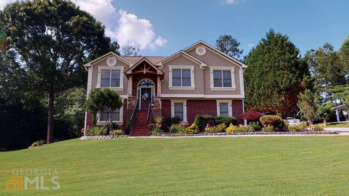 By Far The Most Beautiful Split Foyer Home In Highly Sought After Hamilton Mill Location! Come Fall In Love And Be Inspired By All The Beautiful Updates And Details That Can Be Found In This Recently Updated Custom Home. Featuring Two Magazine Perfect Kitchens With Granite Counter Tops And Tiled Backsplashes, A Gorgeous Oversized Kitchen Island, Shiplap Vaulted Ceilings With Beautifully Stained Beams, Beautiful Accent Walls Throughout, And A Cedar Covered Porch With Vaulted Ceilings. Home Also Features A Long Driveway Leading To A Two Car Side Garage, Beautifully Landscaped Front And Back Yards, And A Detached Two Car Garage And Workshop! This Beautiful Home Is Close To Shopping, Dining, Great Schools, And Has No HOA! Checkout Virtual Tour Link For Matterport Tour!