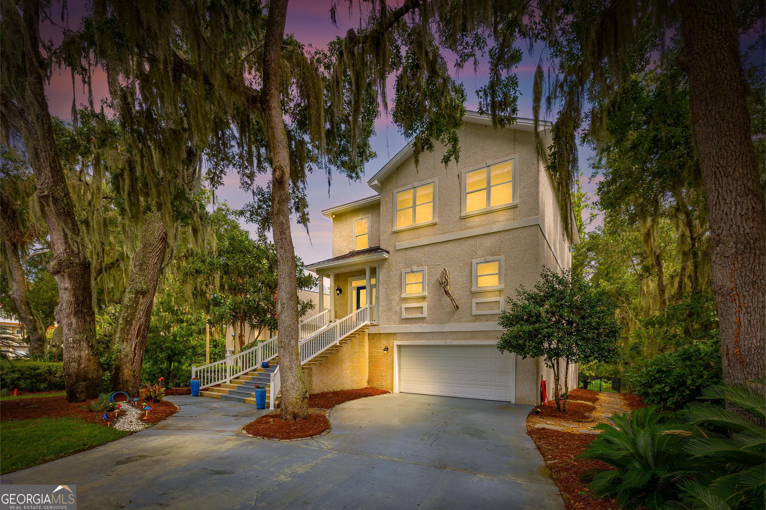 Discover the appeal of island living at 104 Montrose, a beautifully updated retreat in the heart of Hampton Plantation where comfort meets coastal charm on St. Simons Island's scenic north end. This spacious residence offers over 3,000 square feet of thoughtfully updated living space, including newly installed luxury vinyl plank flooring on the main level, fresh interior paint throughout, and updated bathrooms. The open kitchen features new stainless steel appliances, a custom coffee bar, and dining area. The main-level primary suite includes a soaking tub and separate shower, while upstairs offers three additional guest bedrooms and abundant storage. A pre-framed elevator shaft allows for future convenience, and the lower level provides flex space perfect for a gym, storage, or home office. Relax & unwind on the spacious screened-in back porch or downstairs patio with grilling area and fire pit-all within a fully fenced, tranquil backyard with a pocket marsh view! A flooring allowance is being offered for upstairs carpet replacement. Located just steps from the King & Prince Golf Club, pool and tennis courts, this home combines comfort, style, and coastal living! Membership opportunities available for use of club amenities. Additionally, there is a marina located beyond the north gate that also offers membership options for boat/kayak launching and storage.