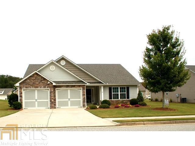 Beautiful Home in an Active Adult 55+ Community - Open Floorplan, Vaulted Great Room, Spacious Kitchen with Pantry, and cabinet pull outs , Stained Cabinets, and Lots of Counter Space. Separate Dining and Sun Porch! 3 Bedrooms, 2 Baths, Large Laundry Room, and 2 Car Garage. Easy access for bringing in groceries from car. Georgous landscaping with Concrete Curb Edging. HOA Fee includes Yard Maintenance, Swimming Pool & Community Club House. One Owner, Home Well Taken Care Of.