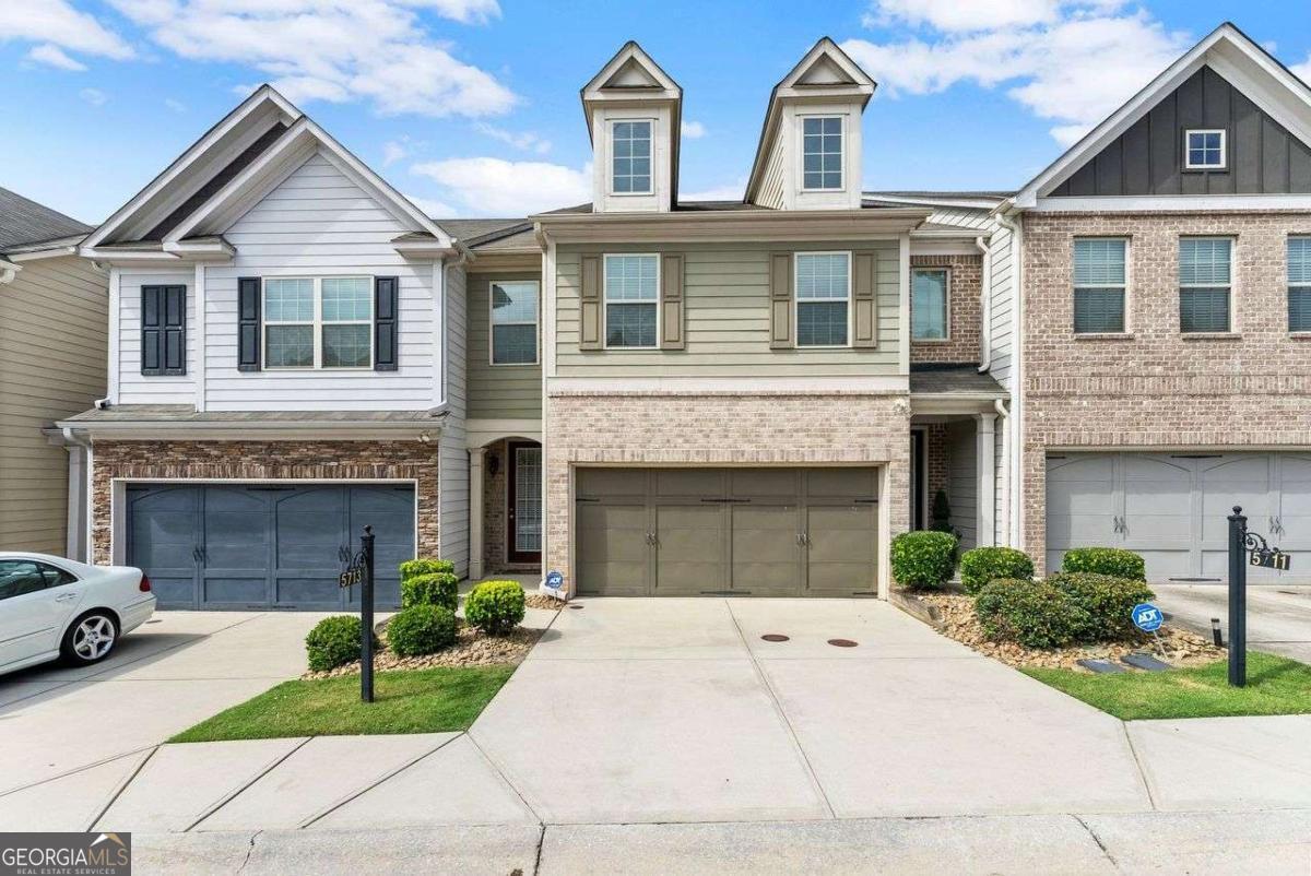 ake a tour of this spacious townhome in a beautiful swim/tennis community featuring 3 bedrooms, 2 1/2 baths, and a FENCED BACKYARD! This home has updated finishes with modern lighting and a dramatic living room accent wall. The extended foyer leads to an open-concept design that seamlessly connects the spacious kitchen with lots of cabinetry, walk-in pantry, dining area with seating for up to 6 persons, and living room with fireplace-perfect for relaxing or entertaining. You'll also find the powder room on this level, along with a 2-car garage. Upstairs, you'll find three generously sized bedrooms and two full bathrooms as well as the laundry room. The stunning oversized primary suite offers a sitting area, spacious walk-in closet, en-suite bathroom with dual sinks and separate soaking tub and shower. The HOA covers both front and backyard lawn care, amenities and pest control. The community amenities include swimming pool, tennis courts, clubhouse and sidewalks, grass areas, park benches and guest parking in this well-kept community. The location is ideal within just minutes to Hartsfield-Jackson Airport, shopping, dining, parks and major highways, as well as close proximity to Trilith in Fayetteville for easy entertainment! If you're looking for a low maintenance home at a great price, without the brand new price tag, this move-in-ready townhome checks all the boxes!
