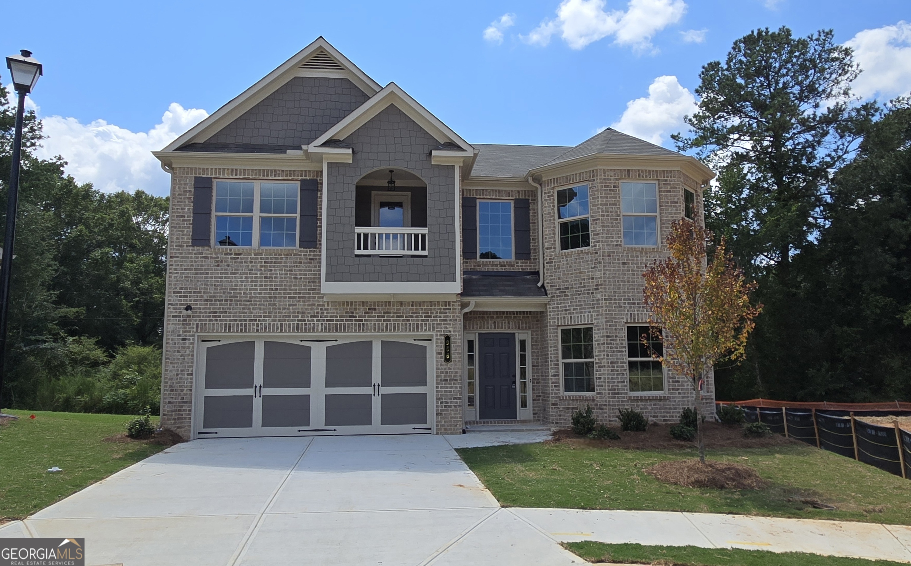 NEW CONSTUCTION!!! GRAND OPENING COMING SOON @ The Oaks at Lake View Community in GRAYSON! 3 sides+ BRICK! Entertainer's Delight! Open Concept! Absolutely stunning 4BR/ 2.5BA Wilmington home design. HARDWOODS on Entire Main Floor, Quartz Countertops, Kitchen Tile Backsplash, Stainless Appliances, Iron Rail Staircase. Upgraded Cabinetry throughout. Huge Family Room w/corner Fireplace, Gorgeous Kitchen with an Oversized Island Overlooking the Family room. Formal Dining Room. Two-story Foyer Entrance. Large Master Bedroom w/ PRIVATE BALCONY great for morning coffee or relaxing after a long day, Walk-in closet. Master Bath will have tile flooring, Garden tub, and Tile shower surround. REAR COVERED PATIO great for Entertaining. New Construction with 2-10 Warranty. HURRY, WON'T LAST LONG! *GPS* USE 913 Grayson Pkwy, Grayson GA 30017.