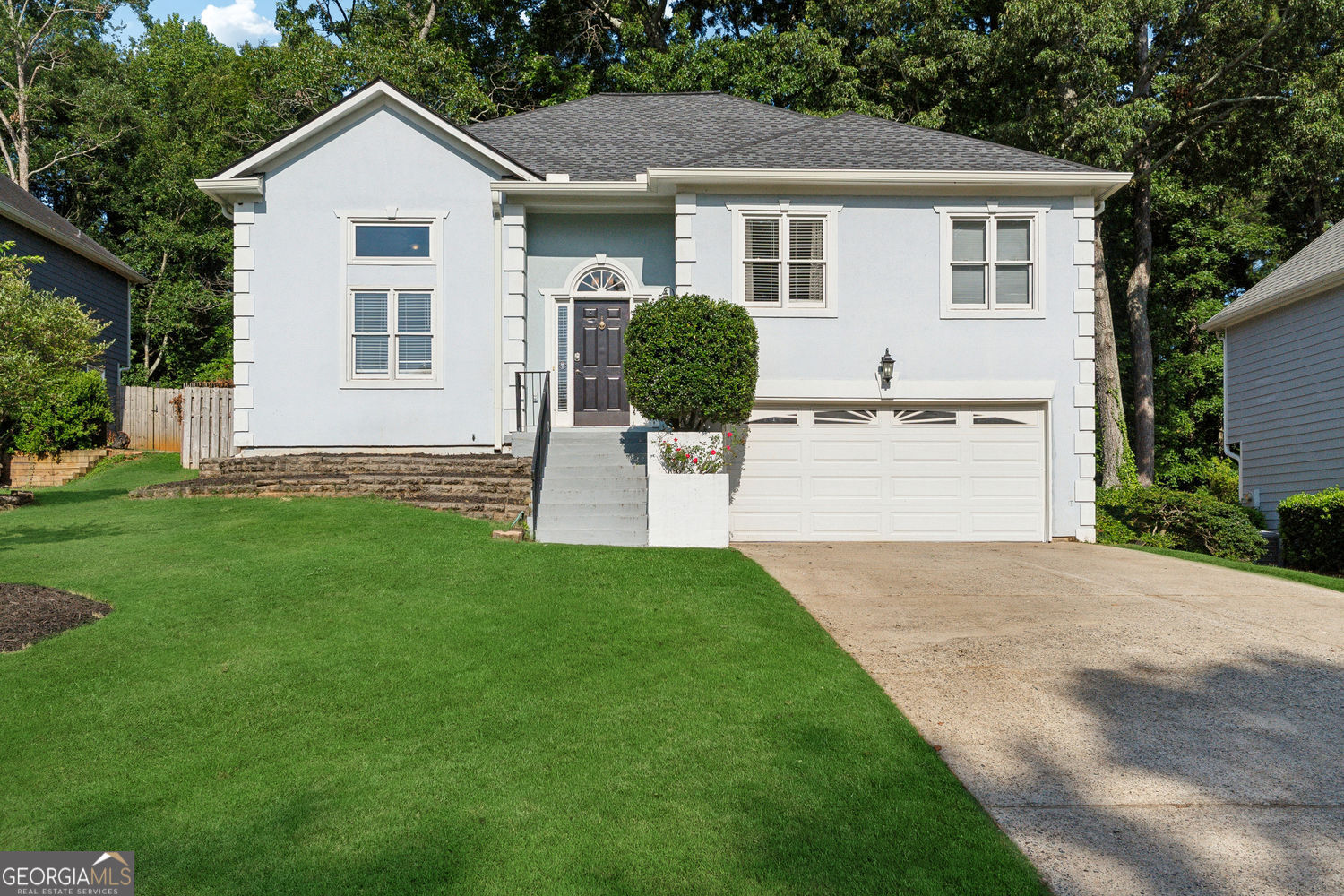 Welcome to 760 Whitehall Way in the desirable Whitehall neighborhood of Roswell. This spacious home sits on a quiet, private lot and offers a great mix of space, comfort, and versatility. Inside, you'll find vaulted ceilings and large windows that bring in tons of natural light. The main level features hardwood and tile floors, an updated kitchen with plenty of storage, and a cozy fireplace in the living area. All bathrooms have been recently renovated with clean, modern finishes. Not to mention this beautiful home has a brand new AC, new roof, new gutters, and new paint inside. The finished terrace level includes its own private entrance, a second updated kitchen, another living space with a fireplace, a bedroom, and a full bath-ideal for extended guests, in-laws, or work-from-home needs. The fenced backyard features a spacious deck and offers just the right amount of privacy. Located just minutes from both Downtown Roswell and Alpharetta, you'll have easy access to parks, shopping, restaurants, top schools, and major commuter routes. It's a well-maintained home in a sought-after Roswell location with room to make it your own!