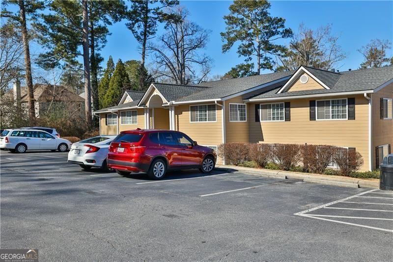 Discover the epitome of luxury living in this stunningly renovated 2-bedroom, 2-bathroom condo located within the gated community of Carlyle Woods in Brookhaven. Boasting a newly updated white kitchen with stainless steel appliances, renovated bathrooms for your relaxation, and custom built-ins in the primary bedroom providing ample storage, every detail exudes comfort and style. Enjoy access to an array of amenities including a state-of-the-art fitness center, resort-style swimming pool, and meticulously landscaped grounds ideal for leisurely strolls or outdoor gatherings. With gated entry and assigned parking ensuring security and peace of mind, convenience is paramount. Positioned for effortless living, indulge in a variety of dining options, bars, and entertainment venues within walking distance. Close proximity to Children's Hospital, Chamblee, Buckhead, and easy access to I-85 and Buford Highway's culinary delights further enhance the appeal. Move-in ready and awaiting your personal touch, seize the opportunity to experience the pinnacle of Brookhaven living.