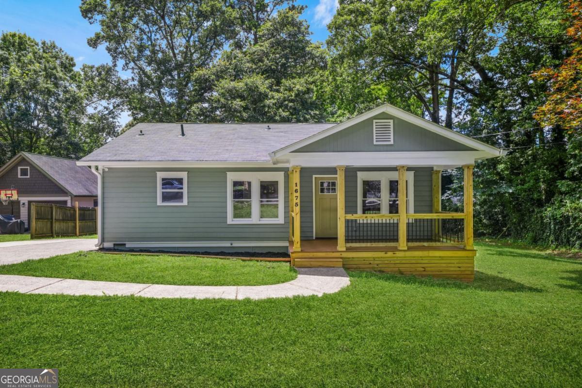 Welcome to 1675 White Oak Way, where timeless bungalow charm meets top-to-bottom modern upgrades. This stunning home has been meticulously renovated with no detail spared. Enjoy peace of mind with all-new plumbing, electrical, HVAC, gutters, windows, and doors-inside and out. Step inside to discover brand-new flooring throughout and a beautifully redesigned kitchen featuring quartz countertops, sleek stainless steel appliances, new cabinets, a farmhouse sink, and designer finishes that make cooking a pleasure. Bonus Offer: Seller is including a brand-new refrigerator with a full-price net offer!The spacious living area is anchored by a custom built-in fireplace with a striking accent wall. Retreat to the all-new primary suite, complete with a luxurious custom tile shower. Outdoor living is just as impressive with new porch woodwork and railings and a brand-new 10' x 20' back deck, perfect for entertaining, grilling, or relaxing after a long day. Conveniently located in Decatur, you'll love being minutes from restaurants, parks, and all the city has to offer. Schedule your tour today and experience this move-in ready masterpiece for yourself!
