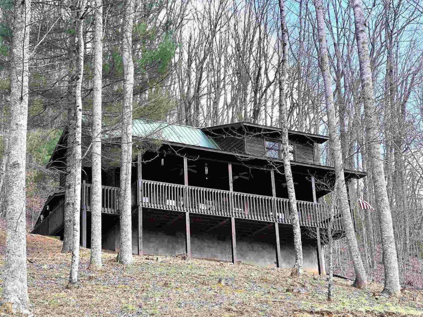 Rustic, Roomy and Ready to move in! This quality built cabin has 2 large bedrooms and 2 full baths plus a huge loft overlooking the living area, nice front porch to take in the nearly 180 degree long range mountain views, open floor plan with good sized living area that has a cathedral ceiling and stone fireplace with gas logs. Very well maintained and recently stained on the exterior. The home comes furnished down to the pots and pans. All paved access. Located in the Scenic Choestoe District and very near Vogel State Park, Brasstown Bald, the Appalachian Trail and thousands of acres of Forest Service. (Better photos coming soon)