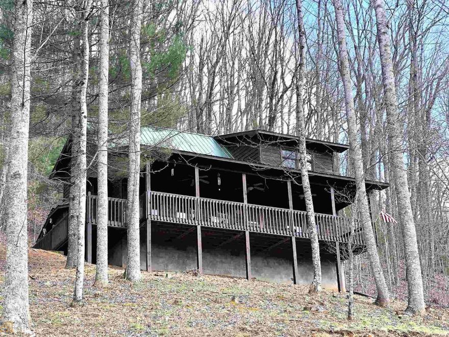 Rustic, Roomy and Ready to move in! This quality built cabin has 2 large bedrooms and 2 full baths plus a huge loft overlooking the living area, nice front porch to take in the nearly 180 degree long range mountain views, open floor plan with good sized living area that has a cathedral ceiling and stone fireplace with gas logs. Very well maintained and recently stained on the exterior. The home comes furnished down to the pots and pans. All paved access. Located in the Scenic Choestoe District and very near Vogel State Park, Brasstown Bald, the Appalachian Trail and thousands of acres of Forest Service. (Better photos coming soon)