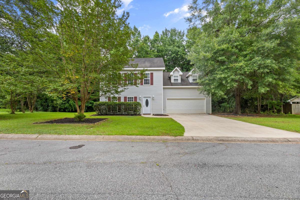 Welcome home to this delightful two-story retreat, where comfort meets functionality. Step into a bright and inviting foyer that flows seamlessly into a spacious family room-ideal for both everyday living and entertaining guests. The kitchen offers a generous eat-in area and ample cabinet space, perfect for hosting and home-cooked meals. Upstairs, you'll find three well-appointed bedrooms, including a versatile bonus room that can serve as a home office, playroom, or guest space. The luxurious owner's suite features a relaxing jetted tub-your personal haven after a long day. Enjoy peace and privacy in the level backyard, offering the perfect space for outdoor gatherings or quiet evenings under the stars.