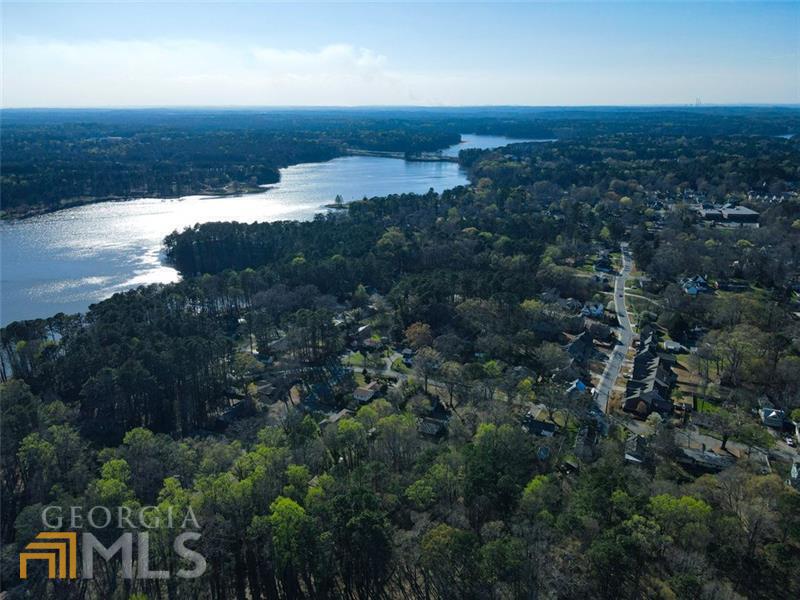 Pre listing appraisal valued the home at seven hundred and twenty five thousand dollars. Move in today and get instant equity! Designed to meet all your needs! Custom-built home with all the charm of an old historic downtown Acworth house. A short walk to downtown, Lake Acworth, walking trails and Logan Trail Park. This home has the potential for short- or long-term renters in the basement with 10ft high ceilings, separate entrance, separate laundry in the kitchen with custom cabinets and granite counter tops. The guest bedroom on the first floor has extra wide door frames for easy wheelchair access. The hand picked tile and steeples shower complete the on suite bathroom. An entertainer's dream with the open floor plan, gas fireplace with the flip of a switch, and voice activated lights Additionally, the main floor boasts granite countertops, a custom hand cut stone back splash, stainless steel appliances, a master bedroom on the main, as well as a scenic view of the creek off the back deck. An oversized walk-in shower complements the extra-long jetted tub in the master bath. Three laundry rooms, one on each floor, with one in the master bedroom closet. There are two additional bedrooms upstairs, office, and bonus room. For a real theater experience, unwind in the media room with extra-large screen and projector. If all of this wasn't enough, there's even a golf cart garage for you to park in after a night out! Could you ask for anything more?