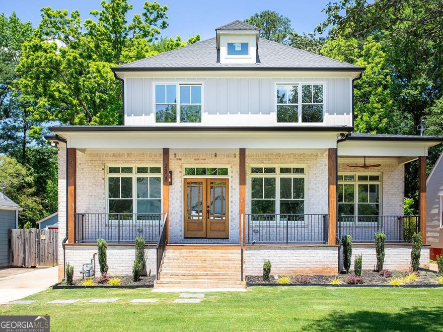 Embark on a journey of modern elegance with this gorgeous 4-bedroom, 4-bathroom sanctuary, set upon an expansive .40 acre lot in the vibrant heart of East Lake. Designed with a seamless blend of contemporary flair and timeless sophistication, this home boasts an expansive layout accentuated by soaring 10ft+ ceilings and exquisite wide-plank flooring. The living room serves as the focal point, showcasing a sleek custom built-in wall with ample shelving space and a striking porcelain tile fireplace, inviting both warmth and engaging conversations. Retreat outdoors to the covered front porch, offering a serene space to relax and soak in the neighborhood ambiance. Adjacent to the living area, a formal seating and dining space awaits, adorned with a stunning Natural Large CF Woven Chandelier, perfect for hosting gatherings and entertaining guests. The kitchen features a generously sized island adorned with luxurious quartz countertops, porcelain tile backsplash, and high-end Z-line appliances. A dedicated bar area adds a touch of sophistication, ideal for evening cocktails and intimate gatherings. The lower level presents a versatile bedroom and full bathroom, ideal for a home office or guest suite. Upstairs, discover a private retreat in each bedroom, with all second-level bedrooms boasting full ensuite bathrooms. The master suite exudes tranquility, boasting custom built-in bench seating surrounding a captivating centerpiece fireplace and a spacious walk-in closet. Step onto the primary suite balcony to overlook the backyard and start your day on a serene note. The primary bathroom offers a spa-like ambiance with dual floating vanities, built-in LED lighting, and abundant cabinet storage. Indulge in relaxation with a soaking tub and separate oversized rainfall shower. Outside, the expansive lot beckons endless possibilities, with an oversized 2-car garage providing additional storage. Whether envisioning verdant landscapes, an outdoor entertainment haven, or even a future pool or ADU, each possibility contributes to crafting your personal oasis in this East Lake residence. Conveniently located just minutes from Oakhurst Village, the shops and restaurants of Kirkwood, and downtown Decatur, this home offers unparalleled access to the vibrant Atlanta scene. Welcome home to luxurious living at its finest.