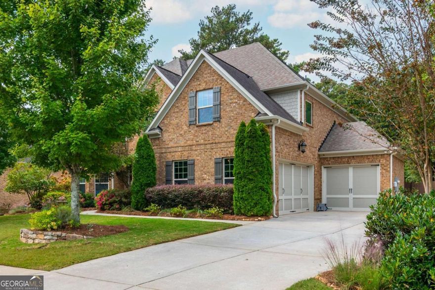 Imagine a meticulously maintained brick Estate Home, with soaring ceilings and Open Floor Plan, so convenient to everything you can't imagine being located on a quiet street with a sprawling yard that suits all lifestyles. Welcome to 2571 Walden Estates, located in one of our favorite Luxury Communities in East Cobb.  A symphony of space and style, this 5 Bed, 4 Bath home unfolds across nearly 3,800 Square Feet promising a uniquely curated space for everyone in your family, including your fur baby! Enter through the stained solid wood door into the foyer with a barrel-vault ceiling. Your office with coffered ceilings & french doors is located to the left and the perfect quiet setup with tons of light so you don't have to go to that lifeless office at corporate headquarters.  Formal Dining Room features trey ceiling, board & batten feature wall & is large enough for 12 person gatherings.  Straight ahead, the Family Room awaits you; however, wait a minute. Don't forget to look to your right & notice the custom built & curated residence located 2571-1/2, awaiting your furry friends (or your spouse's new residence when he inevitably ends up in the literal dog house). Family Room flows seamlessly into the Kitchen, forming the heart of the home, & features coffered ceilings & stone fireplace flanked by built-ins.  Kitchen features stained cabinets, granite counters, large single bowl sink, full suite of stainless appliances including gas cooktop & large island with seating. Did someone call Southern Living because your dream pantry includes custom built-ins, butcher block counter, undermount lighting & room for wine/beverage fridge. Rounding the corner is a Mudroom with built-ins, to store all the things, and your 3 garages. Single Garage is equipped with EV Charger. Main Floor also features a Bed & Full Bath that would be ideal for Multi-Gen Living / Lounge / Playroom.  Upstairs, the expansive Primary Suite is perfect for the King & Queen of the home & boasts a tray ceiling, sitting area & spa-like bath complete with double vanity, soaking tub & shower.  TV above the tub, so you don't miss your favorite game or episode of Bridgerton while relaxing (hiding) from rest of the family!  At the end of the Upstairs Hall, you will find 2 additional Beds (Jack-N-Jill) that share a Bath.  Additional Secondary Bed & Bath perfect for larger families or additional Guest Room. Sorry boys, the final Secondary Bed & Ensuite Bath was specially curated for the Princess.  Upstairs features large Media Room / Flex Room w/custom built-ins.  Laundry Room is located just off the Primary Suite.  Freshly painted Exterior with Pro House & Landscape Lighting.  Outside, enjoy a sprawling private fenced backyard ideal for kiddos or fur babies to burn off some energy. Covered Patio with Ceiling Fan & TV perfect for relaxing evenings, outdoor dining / entertaining.  For the gardeners, metal framed beds to grow herbs, flowers & fresh vegetables (for some of us, place to prove we can't grow anything). Stone patio adjacent to garden under magnolia tree for al fresco dining under the stars.  Irrigation, Security Cameras & Exterior Doors controlled by Smart Phone.  You are about to own a gorgeous home in the trifecta of School Districts.  If you head East on Post Oak Tritt & walk, ride or roll to Tritt ES (or as us locals like to call it... the "Disney" of elementary schools). You can head West & in minutes pull up to Hightower MS. Travel a little further West & arrive at Pope HS where Academics & Athletics soar higher than the US National Debt & are ranked as some of the best in all of Georgia.  Estates of Walden is a single cul-de-sac street of Luxury Homes, adjacent to Walden Subdivision, a vibrant Swim & Tennis Community all included in your Annual HOA Dues. Need groceries?  You have 5 options within 2 miles! Shopping, Restaurants, Gas & Historic Roswell all minutes away.  The convenient Location, amazing schools & gorgeous upgrades are hard to beat!