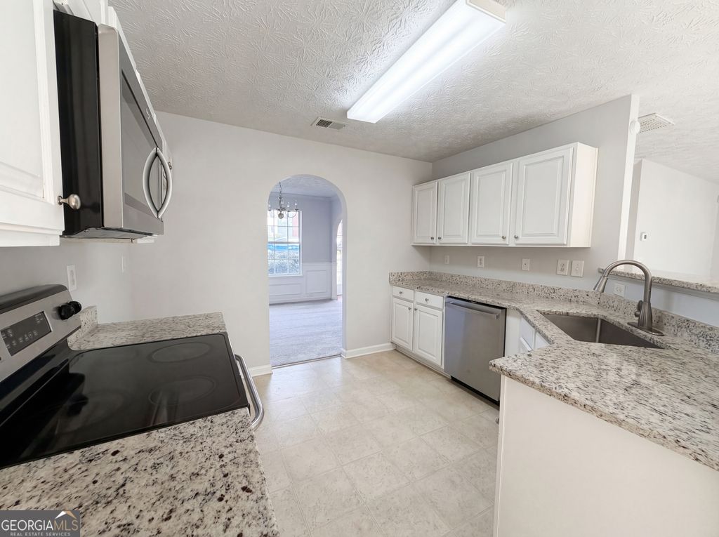 Photo of 6497 Snowden Drive, South Fulton, GA 30349 (MLS # 10721157)