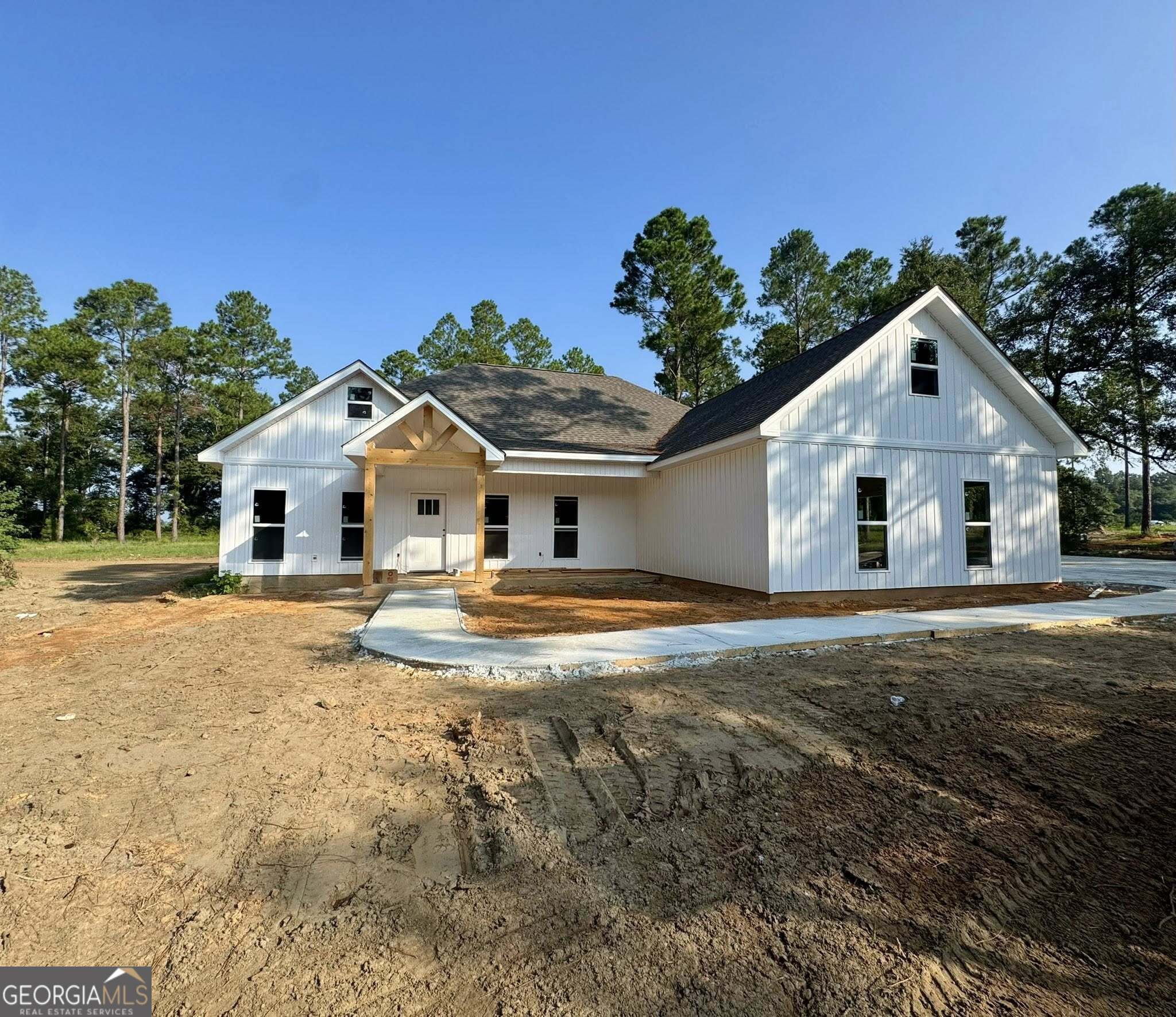 BRAND NEW CONSTRUCTION HOME located on 4.69 ACRES! Exquisite! This one is a must see with it's superb kitchen to it's abundance of crown molding throughout the home. The stunning Kitchen boast a large center island, granite countertops, beautiful tile backsplash, and stainless-steel appliances. Dining Area, Walk-In Pantry, and Spacious Living Room. LVP flooring throughout. With the split floor plan on one side of the home you will find two bedrooms and a hall bathroom with granite countertops, double sinks, toilet room, linen closet, and shower tub combo. Off from the entry way of the home you have your BONUS ROON that is a great flex space for an office, playroom, or even fourth bedroom. On the other side of home you have laundry room with cabinetry and granite countertops. As you continue down the hall you will find the spacious primary bedroom and ensuite bathroom with granite countertops, double sinks, walk-in tile shower, tub, toilet room, and oversized walk-in closet. Covered front and back porches. Private, paved driveway back to home. Great location in the county. Approximately 15 minute drive to Downtown Dublin. The subdivision offers gated access to boat ramp to access the Oconee River. Enjoy boating, fishing, kayaking, sunbathing, and all the perks the river and subdivision has to offer. Covenants do apply. Estimated completion date for home is : End of August 2025. Pictures posted are similar to what completed home will look like. PLEASE BEWARE OF SCAMMERS, THIS HOME IS NOT FOR RENT!