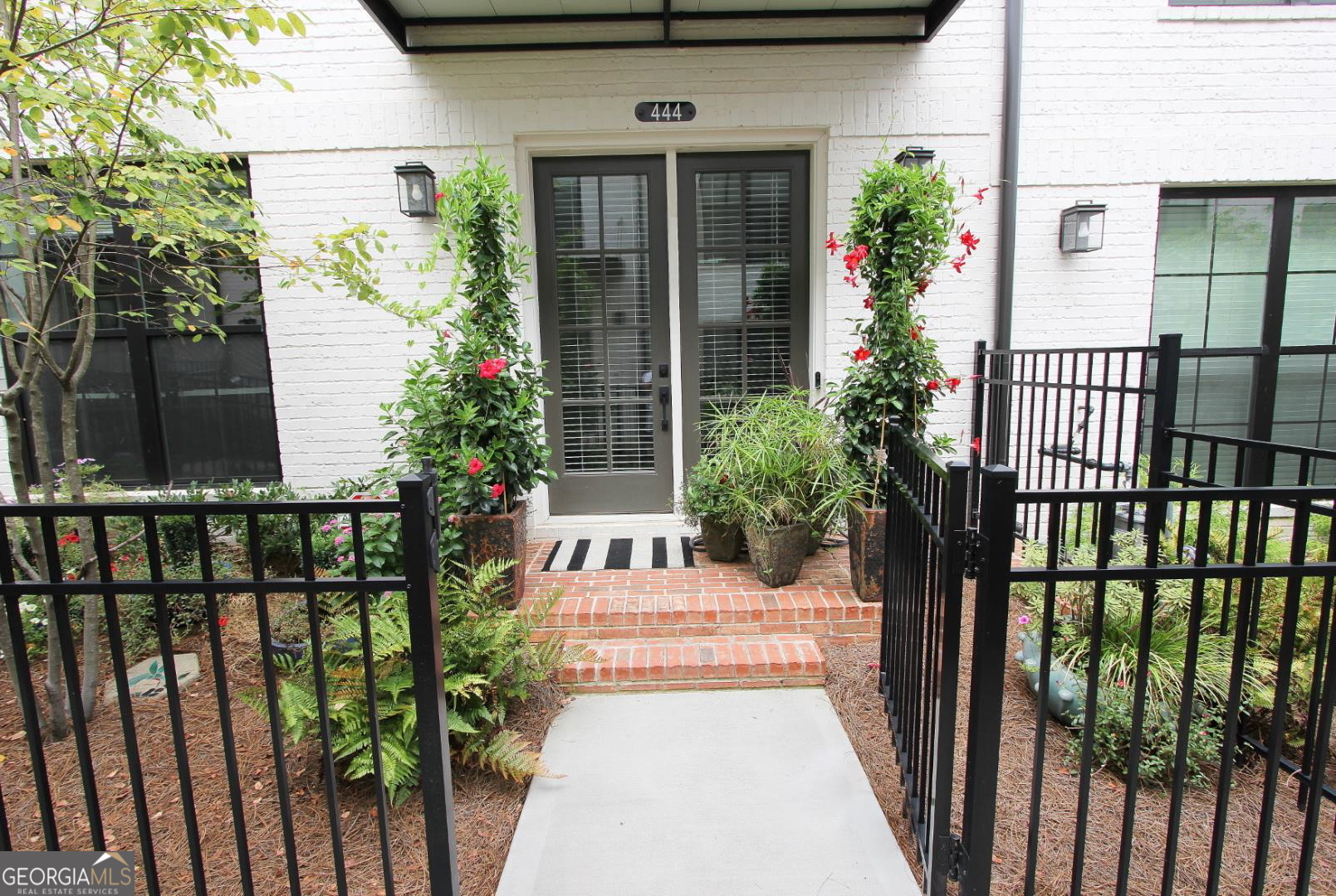 Move in ready! Open floor plan, 4 bedroom, 3.5 full baths with bedroom and full bath on garage level. Quiet neighborhood within walking distance of Avalon, downtown Alpharetta, Alpha-loop for restaurants, shopping and walking/biking. Located in the heart of Alpharetta, but only a few minutes to access GA-400. Upgrades: Hardwoods on all levels (no carpet), Quartz counters, stainless steel appliances, vent hood, direct vent fireplace with box beam mantle, upgraded cabinets, walk-in showers, upgraded lighting, monitored alarm system with cameras and more! Built by Providence Group with a structural warranty until 2032. HOA is responsible for landscaping, building exterior and roof of the townhome. Amenities include: clubhouse, pool, multiple fire pits, bocce ball court, park area and additional parking. Award winning schools in the Milton high school district. Ask agent about lender credits and rate buy-downs.