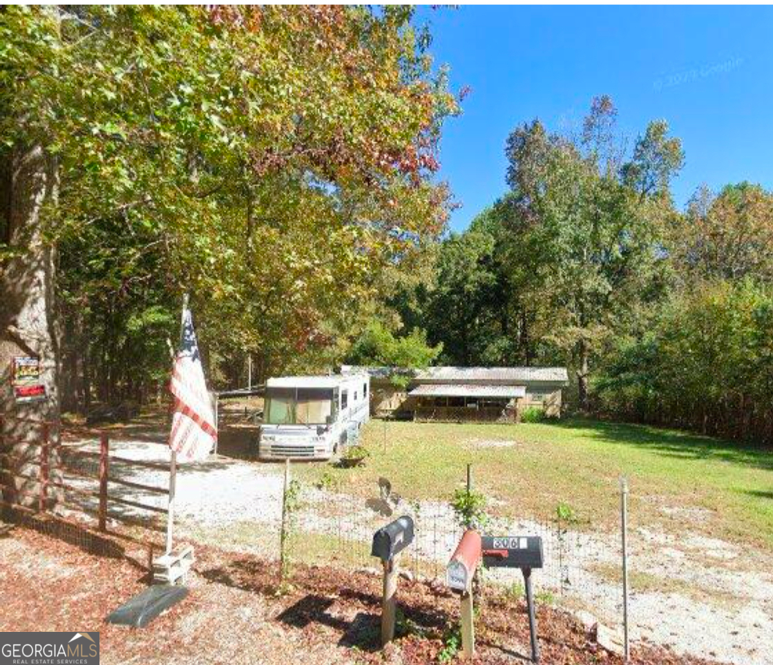 The land property comes with trailer and RV.