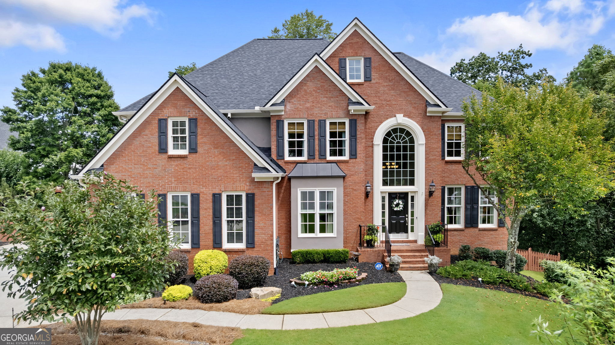 Elegant 6 BR/4.5 bath home with finished basement on gorgeous 1/2 acre cul-de-sac lot in Johns Creek! This beautiful, meticulously-maintained one-owner home is located in the swim/tennis community of Lexington Woods. Estimated value of homeowner improvements is over $150,000. Step into the soaring 2-story foyer with a large office to your left, and living room/flex space to your right. The spacious kitchen is a show-stopper with a Wolf 30" Pro gas cooktop, high-end KitchenAid oven and microwave, farm sink, stunning custom island with granite countertops and walnut cabinet desk. Main level features beautiful hardwood floors, half-bath, huge 2-story great room with fireplace, rear staircase, and 76" windows for maximum light. The dining room seats 12+. Tasteful, neutral colors throughout the home and tons of natural light. Upstairs are 4 more bedrooms including a spacious Owner's Retreat. Completely remodeled EUROPEAN MASTER BATH has heated tiled floors (with thermostat), custom cabinets and mirrors with dual vanities, a rich wood ceiling, Whirlpool tub, a huge seamless walk-in shower with two shower heads, and his/her closets. All bedrooms are oversized. Ample storage everywhere with large walk-in bedroom closets, linen closets and bonus storage areas under stairs, in the basement, and in the garage! The full finished daylight basement offers a perfect retreat for the teenager, mother-in-law, or visiting guests with a media room, workshop, full bath, and kitchen stubbed for an oven/range with refrigerator, sink, mahogany cabinets and granite countertops. Next to the kitchen is the 6th bedroom, which could also be used as a gym/office. You can even add a stackable washer/dryer in the closet! For your security, there's also an ADT alarm system, plus front and back Ring cameras. Full house central vacuum system with separate hoses for each level of the home! New roof (2023) and new deck (2023). Newer double-pane windows including the front palladium window. Three HVAC units (2016, 2021, and 2023) and a 50-gal gas water heater (2023). 6-zone sprinkler system, professionally-landscaped yard, and additional parking pad for 3rd vehicle. Amenities include clubhouse, pool, tennis courts, playground, and basketball courts. Top-rated schools. Near Johns Creek Emory Hospital, Avalon, GA 400, shopping, dining, Webb Bridge Park, and Windward Concourse Business Park.