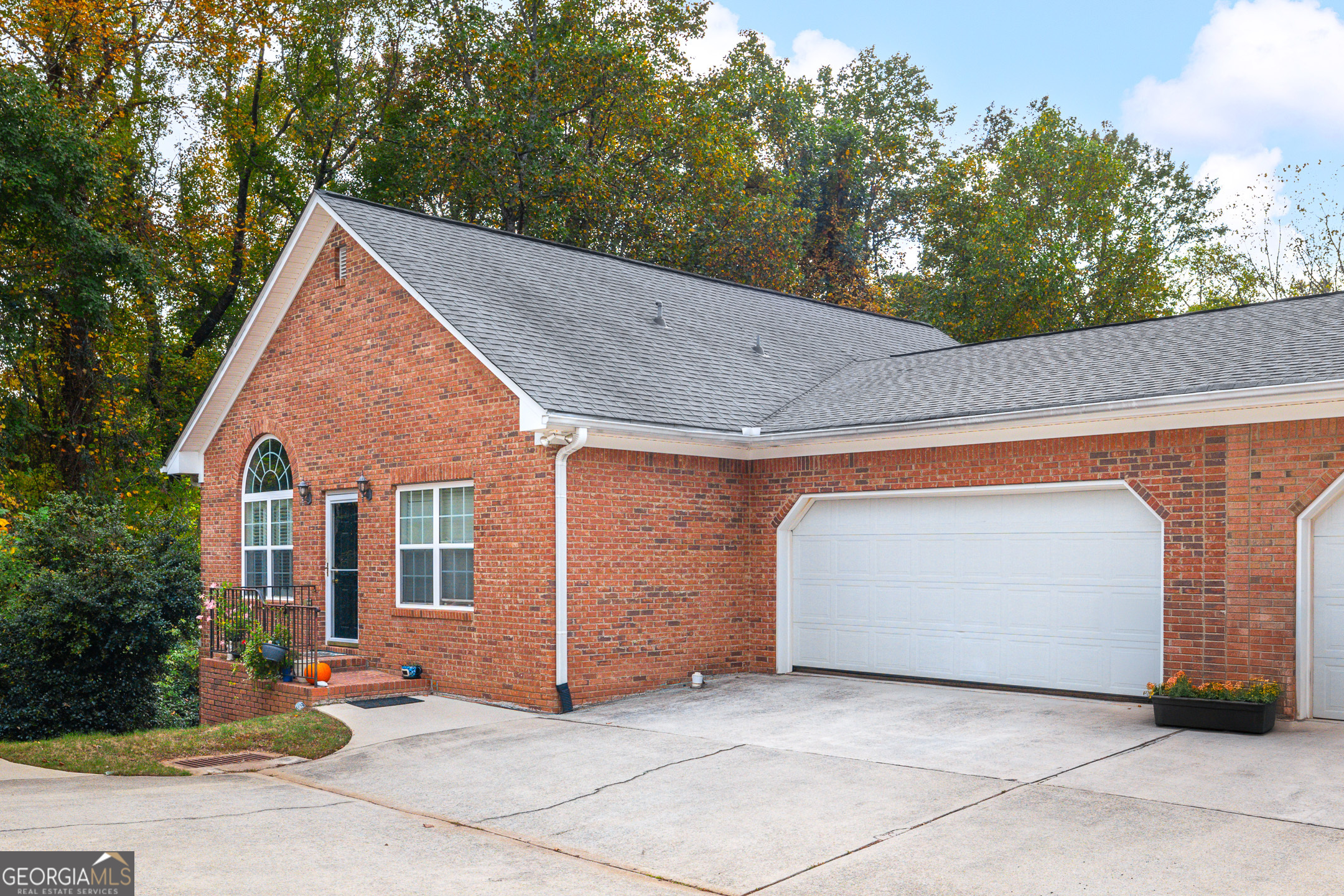 Excellent opportunity for this end-unit one-level ranch style condo with rare unfinished basement! Located in Magnolia Lane, this 2 bedroom 2 full bath property has an inviting and modern floorplan featuring a large fireside living room open to both the dining room and kitchen. Off the dining room is a wonderful deck overlooking the private and wooded common area - perfect for entertaining and cookouts! Two bedrooms on the main level including the primary bedroom with a large private bath w/double vanities and tons of closet space! Off the primary is a small sitting room that would make an ideal home office. Additional bedroom on main level with full bath great for family, guests, or an additional home office or craft room!! One of the most functional areas of the property is the large unfinished daylight basement with walk-out access to the backyard. The basement is perfect for storage and could easily be finished to include a 3rd full bath, additional bedroom, and large media/entertainment room. Magnolia Lane is a delightful community with a neighborhood pool and excellent location near downtown Marietta, Smyrna, restaurants, shops and more!!