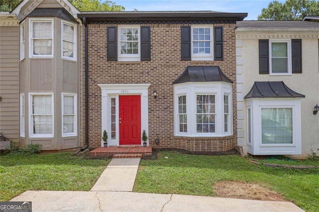 Welcome to this beautifully updated townhome in the heart of Acworth, where modern elegance meets comfort and convenience. Freshly renovated and move-in ready, this home features two spacious upstairs bedrooms, each with its own full bathroom, and a stylish half-bath on the main level. All bathrooms have been upgraded with new sinks and contemporary fixtures. A brand-new 30-year roof was installed in July 2025, ensuring peace of mind for years to come. Inside, you'll find luxurious wood-tone laminate flooring throughout the downstairs and bathrooms, complemented by plush 50-ounce carpet in the bedrooms. The entire interior is revitalized with newly painted walls and ceilings, along with new blinds that provide a clean, cohesive feel. The living room is anchored by a gas log fireplace and enhanced with two modern 6-speed ceiling fans, both equipped with remotes for customized comfort. The kitchen is a true standout, showcasing freshly painted cabinets with sleek hardware, a new modern faucet, and a new garbage disposal. Appliances include a refrigerator, microwave, newer Samsung dishwasher, and a brand-new Whirlpool gas range with matching hood. The adjoining laundry closet holds top-of-the-line Samsung washer and dryer units, making everyday tasks a breeze. Dine under the sparkle of a new crystal chandelier in the bay window alcove, adding charm and ambiance to every meal. Additional features include a SimpliSafe security system for optional monitoring and a locking rear storage room for extra convenience. With its prime location just 0.6 miles from I-75, commuting is easy and efficient. This townhome truly is a rare find, combining thoughtful upgrades with a stellar location. Don't let this showpiece slip away-schedule your viewing today.