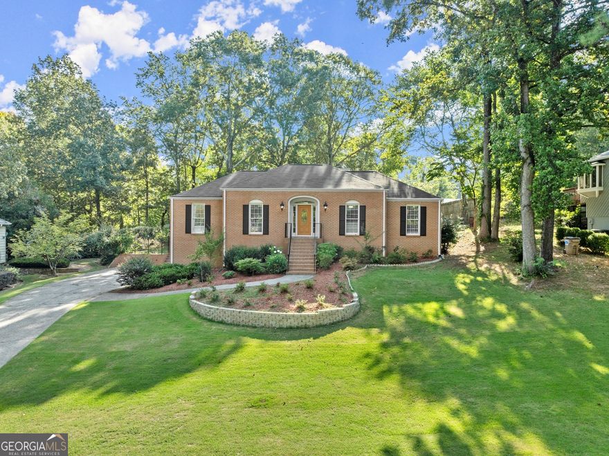 Welcome to your dream home featuring 3-sided brick ranch, perfectly situated in a serene, well-kept neighborhood with NO HOA! Located just minutes from Lassiter High School, this home has modern updates to offer a truly inviting living experience. The family room, with its dramatic vaulted ceiling, exposed wood beams, and cozy fireplace, seamlessly connects to the stylish kitchen and flows to the extra large sunroom. Enjoy the convenience of updated quartz countertops and NEW stainless-steel appliances in both the main and lower-level kitchens. The newly finished basement provides a versatile living space with a stepless entry, complete with a second kitchen, a bedroom, a full bath, and a dedicated home theatre. This area is perfect for extended family, guests, or as an entertainment hub. Recent updates include a new HVAC system, new countertops, 3 new toilets, and much more. The beautifully maintained front yard features recently removed trees and a replaced water line, enhancing the home's curb appeal. The enclosed sunroom adds a fantastic space for year-round entertaining, while the fenced backyard provides a great setting for outdoor activities. The oversized garage ensures plenty of storage space for all your needs.