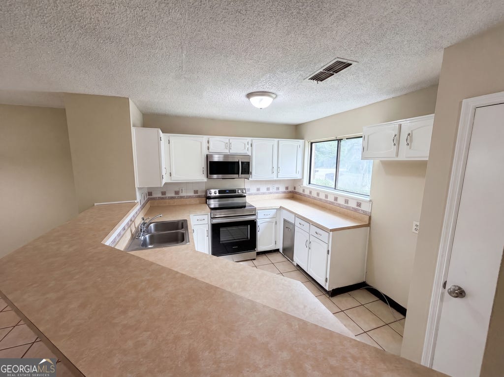 Photo of 3271 Tennington Place #0, Lawrenceville, GA 30044 (MLS # 10781526)