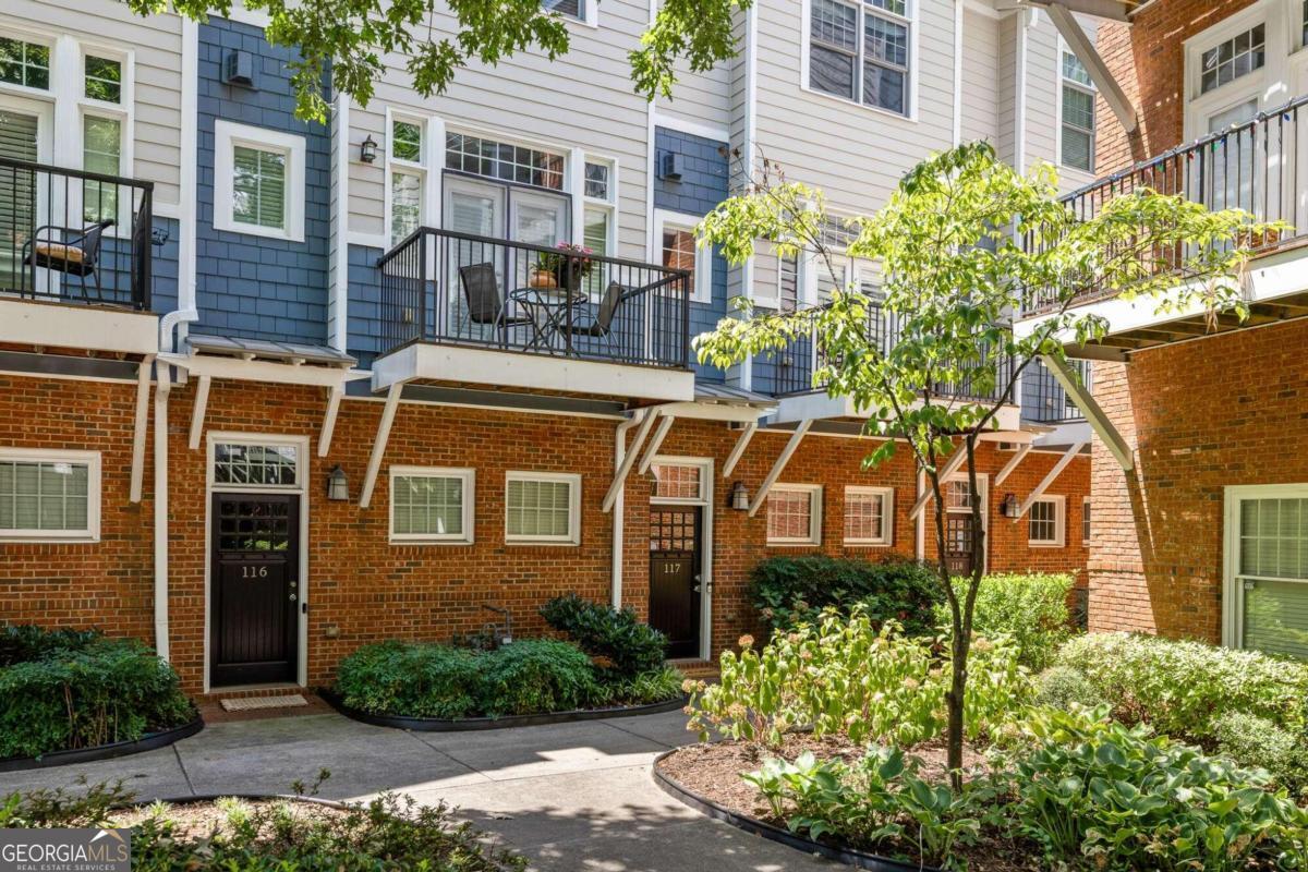Stylish 3-Level Townhome Candler Park    Discover this beautifully updated and well-maintained 3-level townhome tucked just off Dekalb Ave in a quiet row.     The main level features a spacious living room with a cozy fireplace, a dining room, and an updated kitchen with a massive islandCoideal for cooking and entertaining. Enjoy the outdoors on your private balcony overlooking the community courtyard. A convenient powder room for guests is also on this level.    Upstairs, youCOll find two generous bedrooms, each with its own ensuite bath and custom closets. The bonus third bedroom on the lower level is versatile and can be used as an office or guest room, thanks to the built-in Murphy bed.    This townhome boasts an oversized single-car garage with extra storage, providing ample space for all your needs. The incredible location puts you minutes from shops, parks, restaurants, and MARTA, making it perfect for those who value convenience.    Embrace the low-maintenance lifestyle without sacrificing the comforts of a single-family home. Make this stylish townhome in Candler Park yours today!