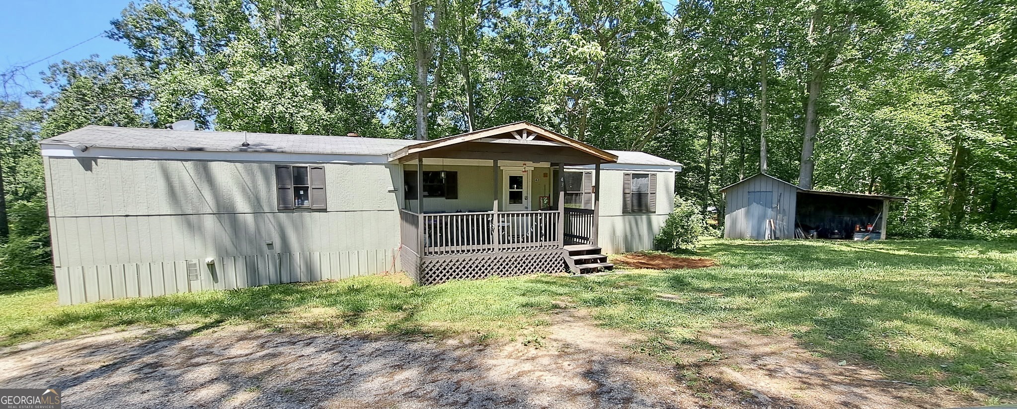 An investor's dream with income already flowing! This updated mobile home sits on a permanent foundation with retired titles, making it financeable and a fantastic long-term investment. Corner, private 1.31-acre lot, the property offers both seclusion and convenience, located just off Hwy 9 for easy access to shopping, dining, and commuting routes. This well-maintained home features updates that appeal to today's renters, and there's already a wonderful tenant in place, making this a turnkey investment with no vacancy downtime. A major bonus is the on-site storage building, ideal for tools, lawn gear, or even additional rental storage potential. With no HOA restrictions, you'll have the freedom to manage the property. The location, income potential, and existing setup make this property an ideal addition to any investor's portfolio.