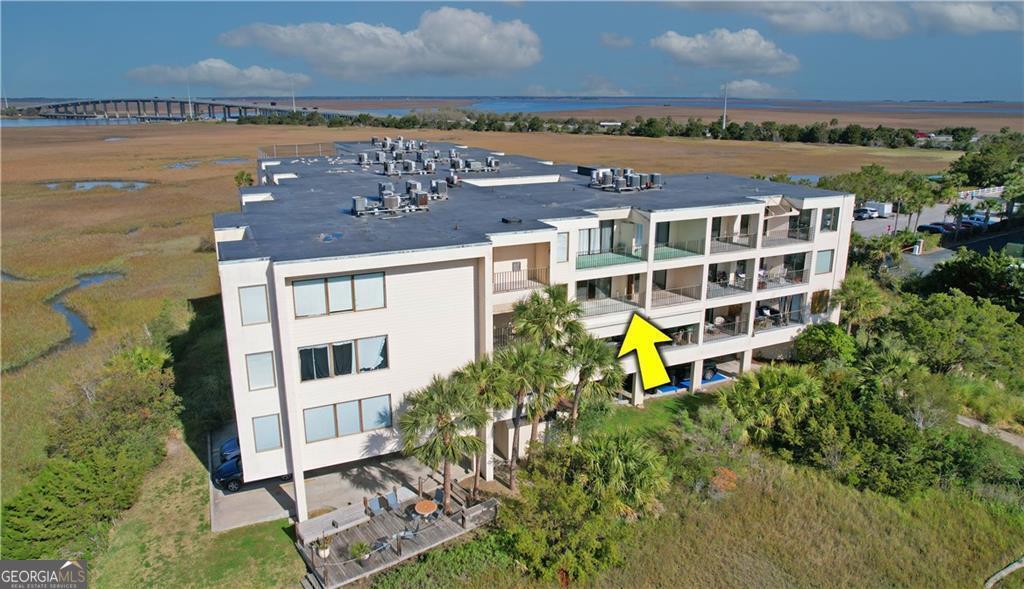 Wake up to breathtaking water and marina views from every window in this unique dual-unit condo on St. Simons Island. With a brand-new roof and a NEW AC system, this property offers comfort, flexibility, and peace of mind. Units 306A (1BR) and 306B (studio) are connected by an interior door-live in one, rent the other, or combine for a spacious retreat. Enjoy coffee on the expansive porch, watch boats pass by, or head up to the rooftop pool with panoramic views. Two nearby marinas keep your boat adventure-ready. Luxury, income potential, and unbeatable waterfront views-don't miss this rare opportunity. The sellers have paid all assessments in full. Take the 3D tour to see this entire property.