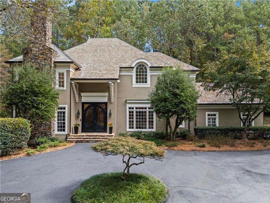 Bill Harrison designed European beauty in Sandy Springs.  Welcome home to your very own resort complete with swimming pool and tennis/pickle ball court.  Gated entry welcomes you home to this hardcoat stucco home on a quiet, peaceful street bordering Buckhead without City of Atlanta taxes.  Convenient to all the private schools and minutes to shopping, restaurants and the Chattahoochee River.  Soaring ceilings throughout. Kitchen and master bath were both completely renovated less than 5 years ago with no detail missed.  Top of the line kitchen appliances, white oak island and gleaming hardwoods throughout majority of home and beautiful Saltillo tile in the terrace level living areas.  Full house generator, dry sauna, gym and fenced backyard. No lack of storage.  This one is not to be missed!