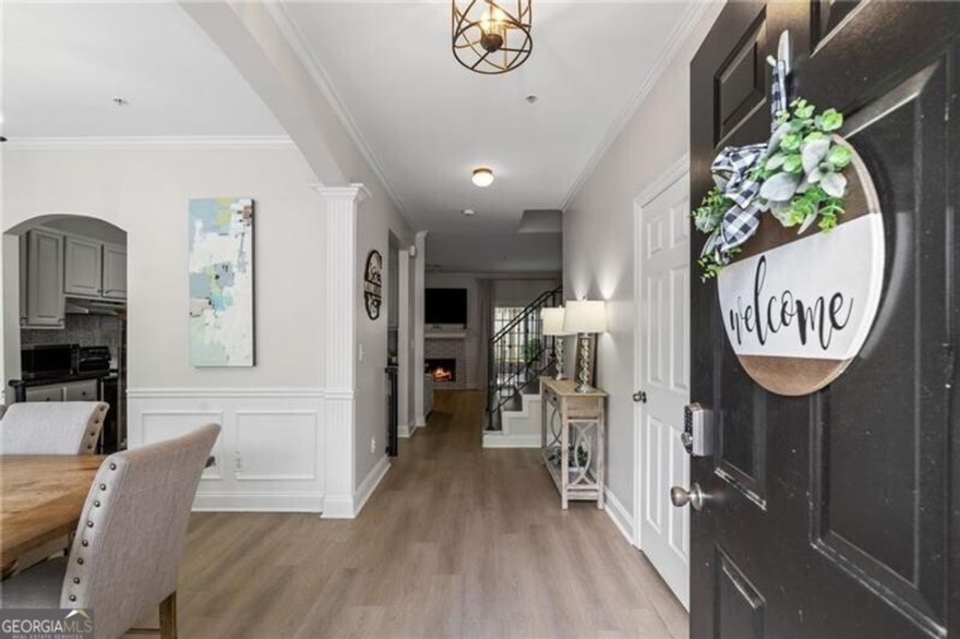 Don't walk, run! Buyer terminated at no fault of the seller AND only 2 days on the market. I am sure you missed it! You will not want to miss it this time. Schedule your showing today. Location is at your fingertips. This 2 bedroom, 2 1/2 bathroom updated townhome is just minutes away from Downtown Alpharetta, Avalon, Crabapple, Wills Park and GA400. Tucked inside a serene, gated community, this beauty offers more than just a place to live-it's your personal sanctuary. You can save money and be close to everything all of Metro Atlanta is talking about. Your family will thank you, your dog will thank you and so will your BFF. Step inside to discover a bright open floor plan that instantly feels like home and flows seamlessly into a dedicated dining space. The kitchen with modern cabinets, a pantry and LVP throughout overlooks a huge living room that flows right over into your very own private courtyard back deck.  Slide open the back doors and find your own private escape: a private fenced deck ideal for sipping your morning coffee, soaking up the sun, or letting the dogs out while you are still in your PJ's. It's open, it's peaceful, and it's all yours.   Low-maintenance living. This townhome offers everything a Condominium offers with the look and privacy of a townhome. The HOA covers water, trash, exterior maintenance, lawn, roof, and termite protection-you can spend more time doing what you love and less time on upkeep. All while feeling safe and secure with a gate at the front entrance. Have you had trouble securing insurance for condominiums in the past? No need to worry-this association is fully insured and meets the requirements for loan qualification. All of this for under $400k. This is a dream. Offered at $364,999, this isn't just a townhome-it's a lifestyle. A fresh chapter in a vibrant community, surrounded by everything Alpharetta has to offer. You do not want to miss this showstopper townhome with all Alpharetta has to offer. Schedule your showing today before its gone.