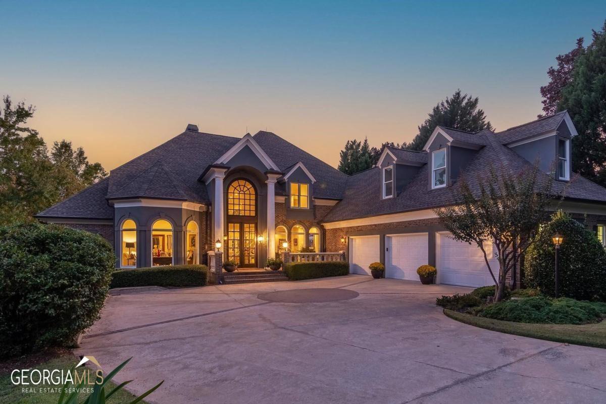 "FRONT ROW SUNRISE AND SUNSET VIEWS EVERY DAY! THIS EXTRAORDINARY RENOVATED HOME AT REYNOLDS COMBINES LUXURY, LEISURE AND UNDOUBTEDLY ONE OF THE BEST LAKE OCONEE VIEWS WITH THE JACK NICKLAUS GREAT WATERS COURSE IN THE BACKGROUND" With unparalleled details, breathtaking views will welcome you the moment you step inside this recently renovated stunning 8,000+ sq ft home offering 7 bedrooms, 6 and half baths. The open floor plan with soaring ceiling on the main level provides an abundance of entertaining spaces allowing you to enjoy the magnificent views of the lake from nearly every corner of the home. The main level features a stunning dining room with custom bar, conversation room, great room, sprawling Chef's kitchen, breakfast room, spacious porch overlooking the lake and the golf course, screened porch, gazebo porch, office, laundry room. The spacious master suite is its own lake retreat in itself with a seating area, tall ceilings, and breathtaking views of the lake. The second floor features four guest suites. The terrace level has a spacious family and activity room with custom full bar and access to the outside lower lake deck. This level also features two bedrooms including a large guest suite with private bath. The expansive backyard features the spectacular lake steps to your own private dock. Live an exceptional lifestyle and boat to Great Waters' Jack Nicklaus course for a round of golf or enjoy dinner with your friends after a fantastic sunset cruise. Minutes to the world-class amenities of Reynolds Lake Oconee. Membership is available.