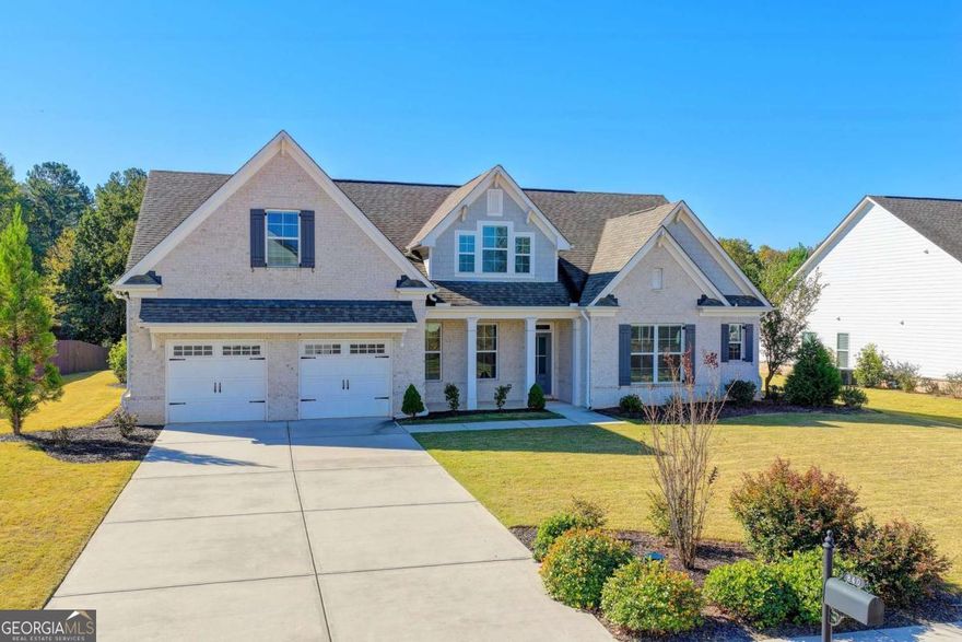 Welcome to the Walker Anderson Homes, a stunning all-hardwood floor ranch-style retreat on a large, level, and private homesite. This beautifully designed home offers the ideal blend of comfort and sophistication, featuring a covered rear porch that overlooks the expansive backyard, perfect for outdoor gatherings, gardening, or simply enjoying peaceful moments in nature.  Inside, the thoughtfully designed main level boasts a luxurious owner's suite and a spacious secondary bedroom, both with private en-suite baths. The open-concept living space is highlighted by a gourmet kitchen with painted cabinets, a gas cooktop with a vent hood, a separate wall oven and microwave, a walk-in pantry, and a mudroom with built-in lockers for added convenience.  Upstairs, you'll find two oversized bedrooms with walk-in closets, a full bath, and a versatile loft-perfect as a media room, play area, or home office.   This home is an exceptional opportunity to enjoy single-level living with additional space for guests or family, all set on a spectacular, level backyard that offers endless possibilities. Don't miss this rare gem!