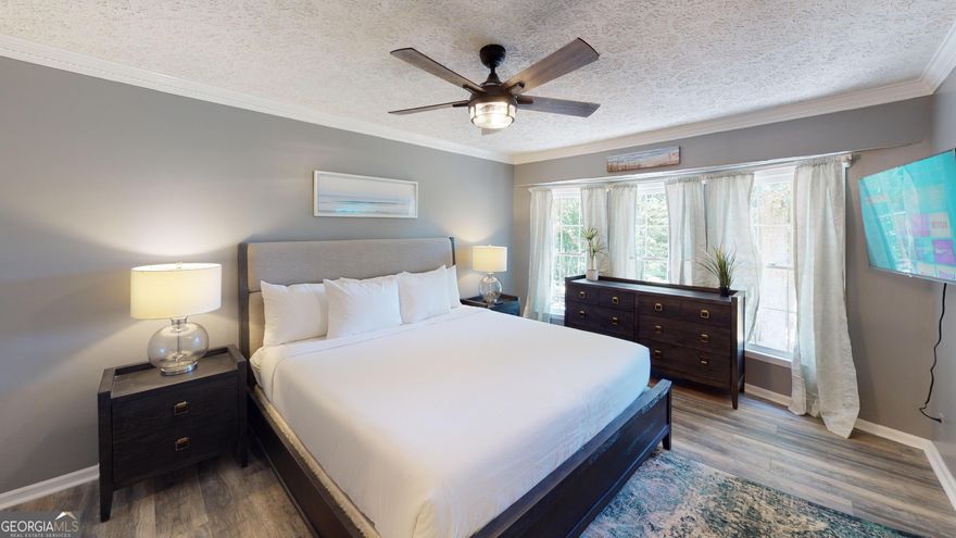 Enjoy the perfect mix of tranquility and convenience in this fully furnished 3-bedroom, 1.5-bath private-entry unit, just far enough from the city for a restful stay - yet close to shopping, dining, parks, and local attractions.    The Space:   Private unit that comfortably accommodates up to 6 guests   Primary bedroom - King bed + private half bathroom   Second bedroom - King bed   Third bedroom - Queen bed   Full bathroom located in the hallway   Fresh bed & bath linens provided in every room   High-speed WiFi included throughout    Outdoor Features:   Cozy porch swing & outdoor patio seating   Hot tub available - please contact us for availability & details   Driveway parking (garage not accessible to guests)   Pet-friendly with applicable fees    Included Amenities:   Fully stocked kitchen with Keurig coffee maker & starter K-Cups   Welcome snacks to get you settled   Utilities, internet, lawn care, and pest control - all included   Peaceful neighborhood with easy access to everything you need    Nearby Attractions:   Crabapple Falls & Vickery Creek Falls at Roswell Mill   The Art Barn   Avalon Shopping Center   Sequoyah Park Disc Golf & Settingdown Creek Golf Course   Tommy Mann Field & J.B. Owens Park    Perfect For:   Families between homes   Insurance-displaced guests   Long-term work stays   Travelers seeking flexible short-term rental options    Good to Know:   Non-smoking property   No events permitted   Children welcome   Long-term tenant occupies a separate shed unit (private entrance, no guest interaction)    Booking Discounts:   10% off stays 7+ nights   15% off stays 30+ nights   10% off last-minute bookings (within 7 days of check-in)    Security Requirements:   TRUVI identity verification required (link sent after booking)   Photo of the card used for payment (must match reservation name) required prior to check-in   Send to +1 (678) 721-8616 or support@suitestaysatlanta.com  (Sensitive info may be hidden - no need to share full card number)     A serene escape with modern comforts - perfect for your next stay in Woodstock! Book now to lock in your dates and enjoy stress-free living.