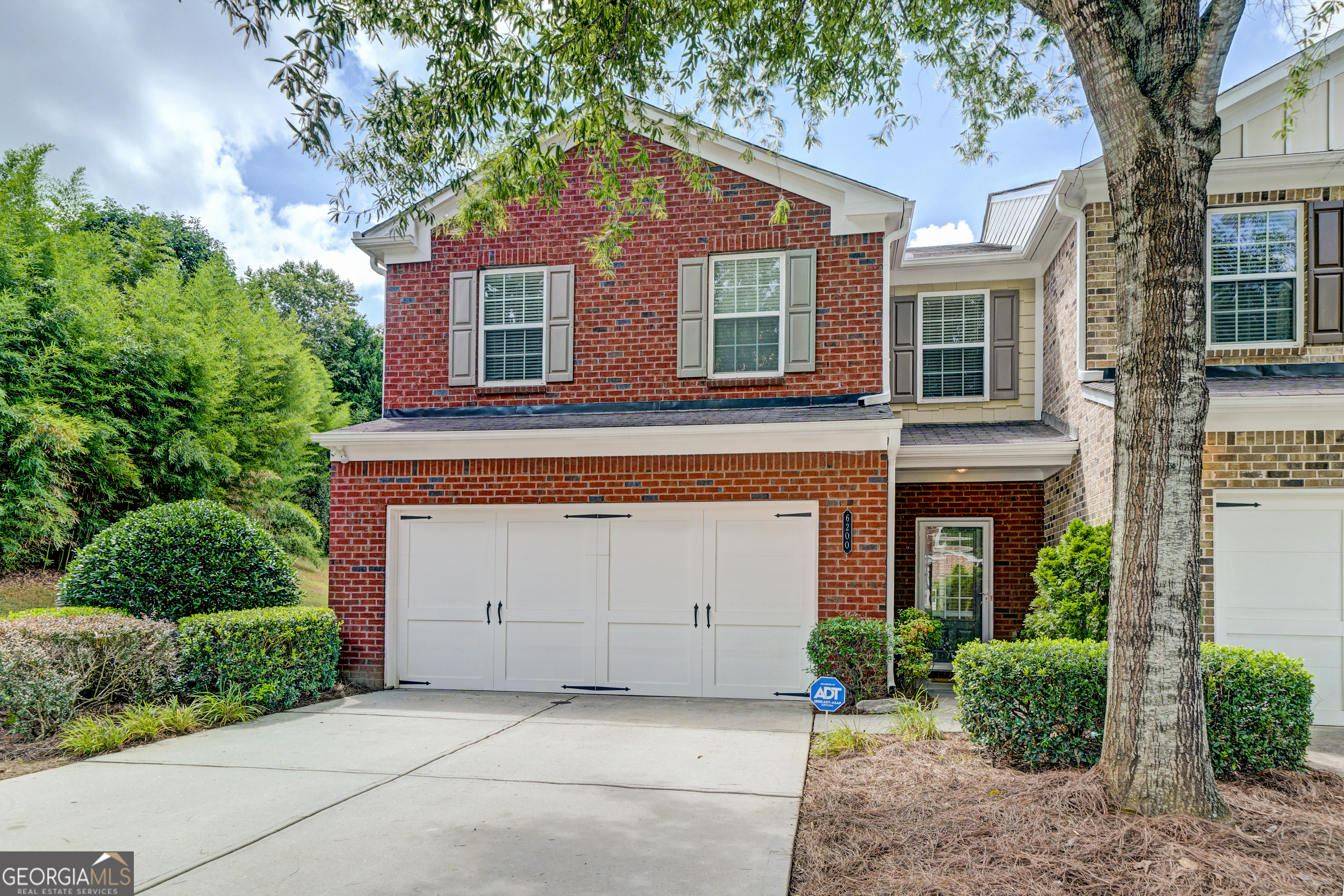 Welcome to this stunning end unit fee simple townhome in the highly sought-after gated community of Bellewood, located in the top-rated Parkview, Trickum and Arcado school districts. Boasting the largest floorplan in the subdivision, this meticulously maintained 3 bedroom, 2.5 bath home offers a perfect blend of space, comfort and luxury. The open main level features gleaming new hardwood floors, a spacious family room with a cozy gas-log fireplace and a dining area that opens to a private patio and lush green lawn. The kitchen is beautifully appointed with maple cabinetry, granite countertops and a breakfast bar ideal for casual meals or entertaining. Upstairs, enjoy a versatile loft/media/office area, an expansive primary suite with spacious walk-in closet and a spa-like ensuite bath featuring a soaking tub, separate shower and stone finishes and two generously-sized secondary bedrooms. Additional highlights include new paint and carpet, new HVAC in 2024, new water heater in 2023, wide crown molding and end unit privacy. Bellewood's gated community amenities include a swimming pool and playground. Conveniently located with easy access to I-85, Hwy 78 and all that downtown Tucker has to offer, this home truly has it all. Don't miss your opportunity to live in one of Gwinnett's best townhome communities!