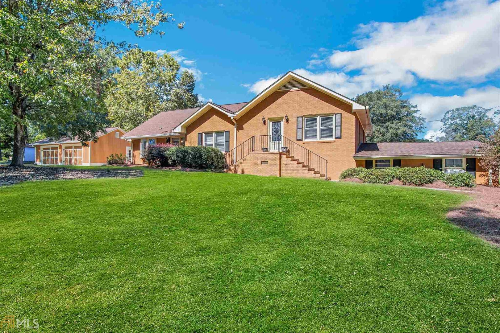 Just under an acre located in recently renovated downtown Winder in walking distance to a mixture of fine dining, local shopping/eateries, hair salons, clothing, etc. Entertainer's dream with large fenced in backyard with oversized pool/ diving board, tiki bar, gazebo, etc. Basement completely renovated with all tile floor, full kitchen, walk in closet, full bath separate driveway for full in-law suite. TENANT PRESENT IN BASEMENT so please make appointment.