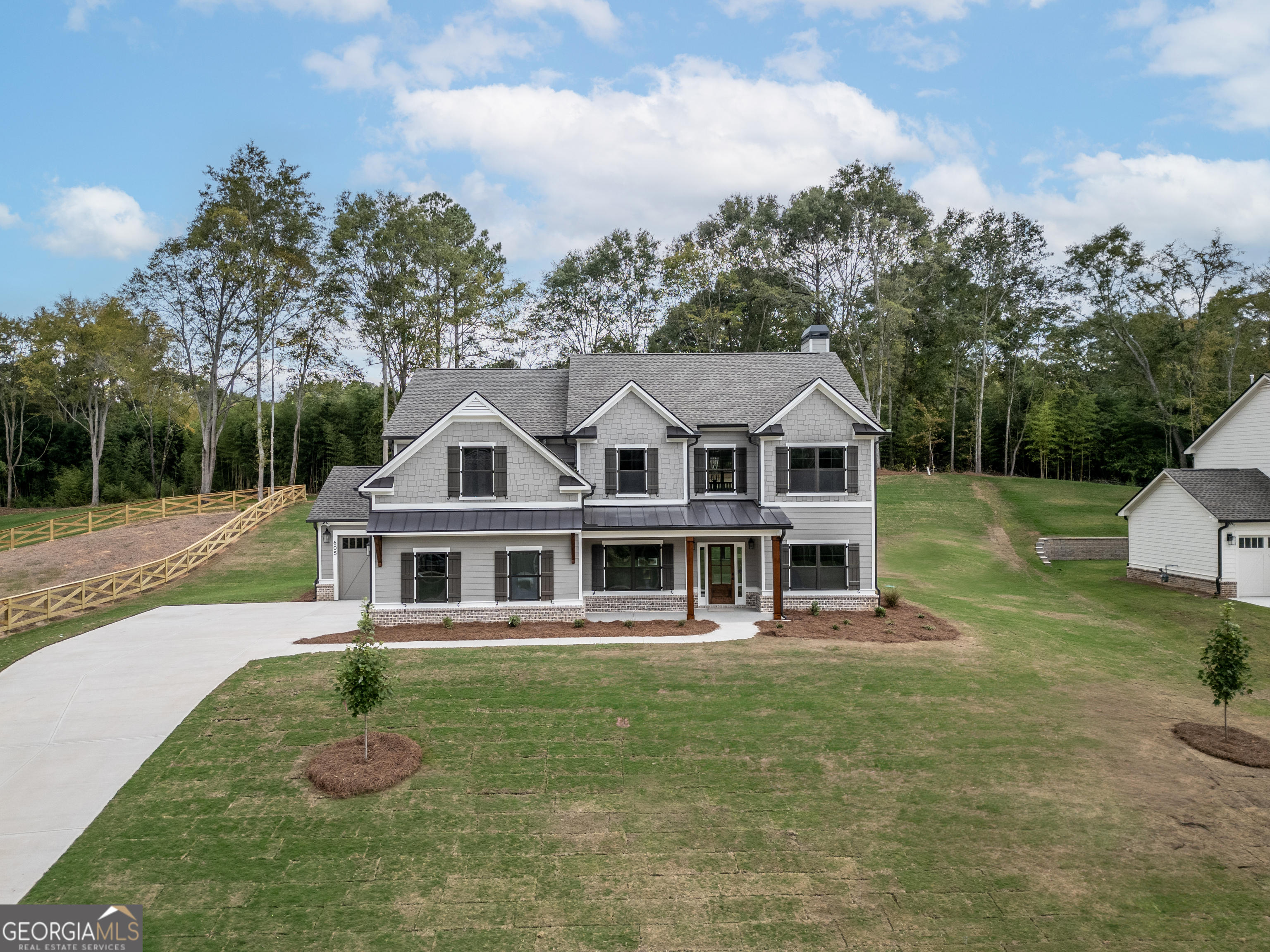 MOVE-IN READY! The Grayson- This 4 bedroom/ 2.5 bath home feature hardwoods throughout the main level which includes the foyer, study, formal dining room, kitchen, family room and half bathroom. The kitchen includes an island, quartz countertops, painted cabinets, breakfast area and walk-in pantry. The kitchen opens up to the beautiful two-story family room that features a beautiful fireplace featuring floor to ceiling brick. The family room and the formal dining room detail a stunning coffered ceiling. The owners suite is located upstairs and includes recessed can lights in the tray ceiling. The owners bathroom features separate his/her vanities, tile shower, separate soaking tub and an oversized walk-in closet. Upstairs includes the laundry room, 3 additional bedrooms and a full bath with double sinks. Minutes from Downtown Monroe. Popular Walnut Grove School District. $20K Buyer Incentive when using one of our preferred lenders.